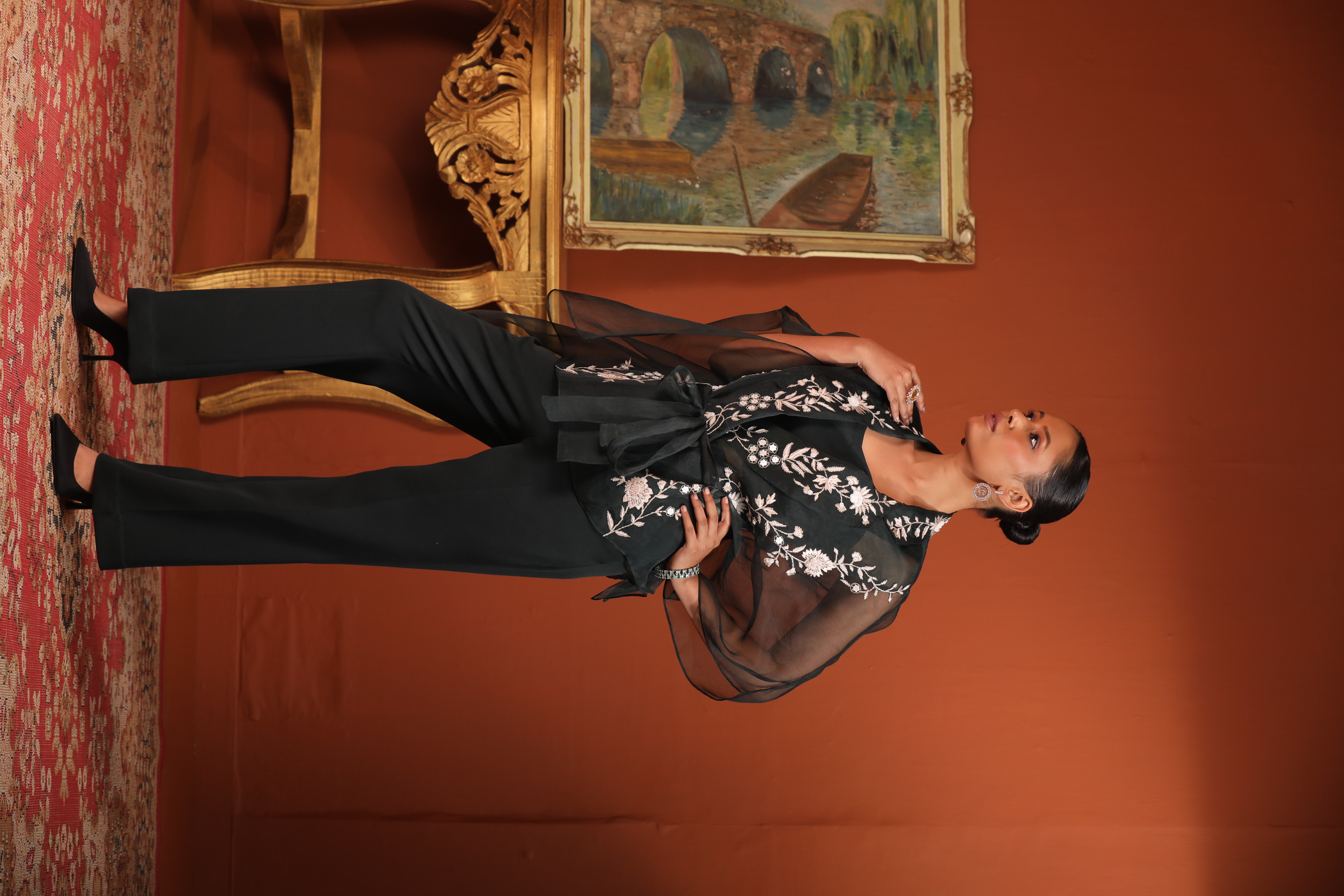 A model showcasing Green Kaftan Top With Bustier Pants by Mavish from Mavish's collection
