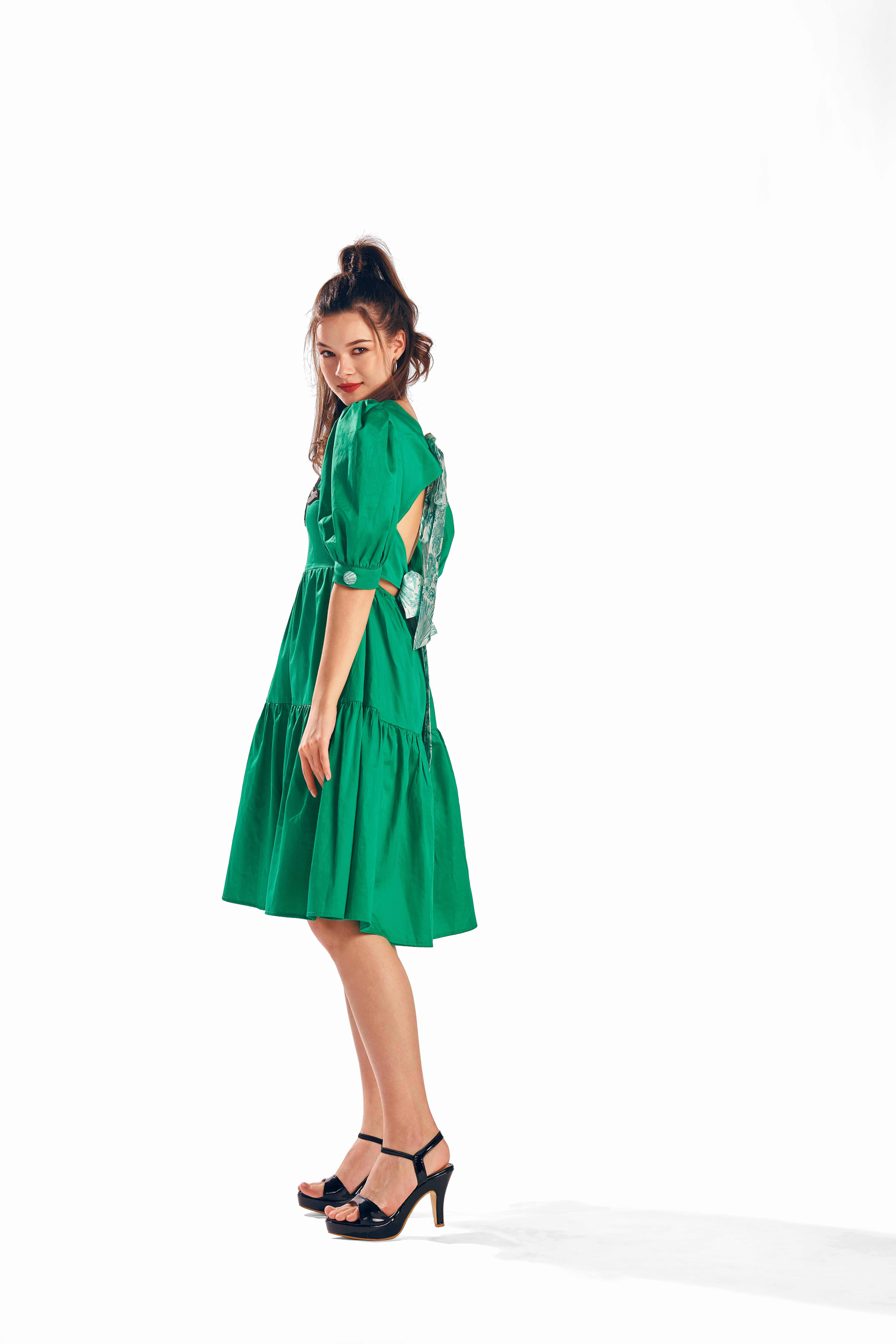 A model showcasing Azure Alcedo Green Dress by Zilaire from Zilaire's collection