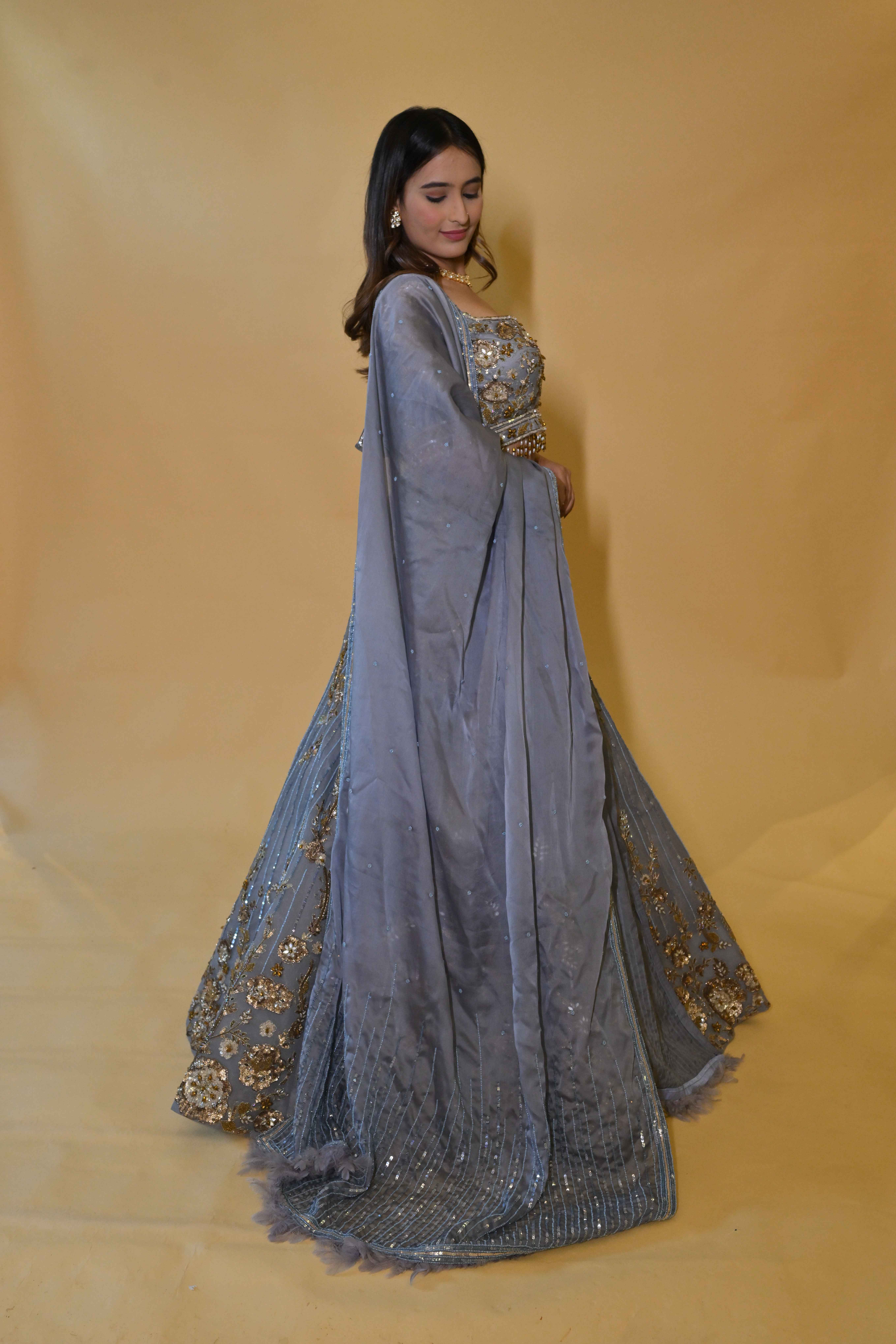 A model showcasing Powder Blue Lehenga Set by Labell Patchouli from Labell Patchouli's collection A model showcasing Powder Blue Lehenga Set by Labell Patchouli from Labell Patchouli's collection