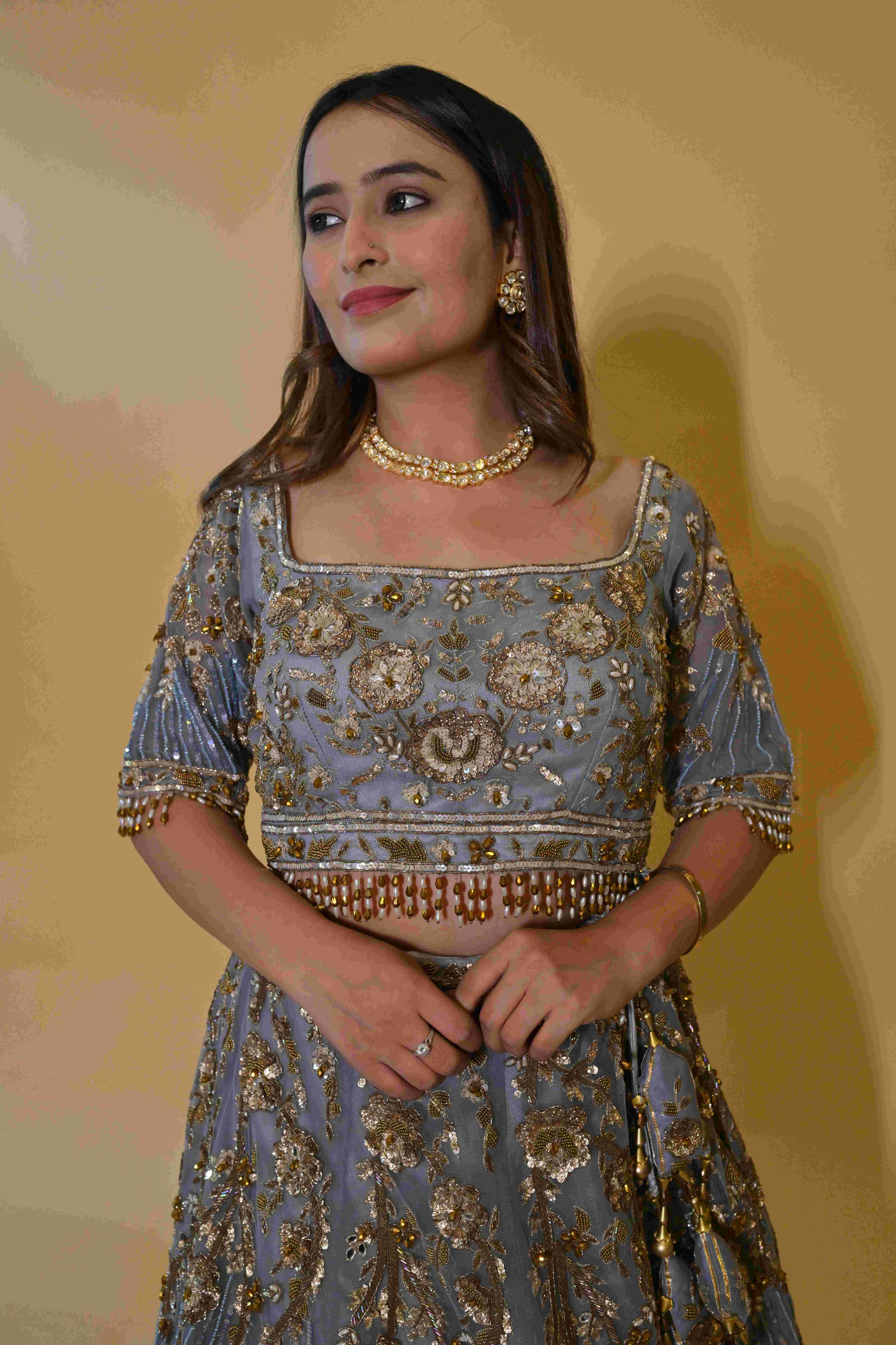 A model showcasing Powder Blue Lehenga Set by Labell Patchouli from Labell Patchouli's collection A model showcasing Powder Blue Lehenga Set by Labell Patchouli from Labell Patchouli's collection