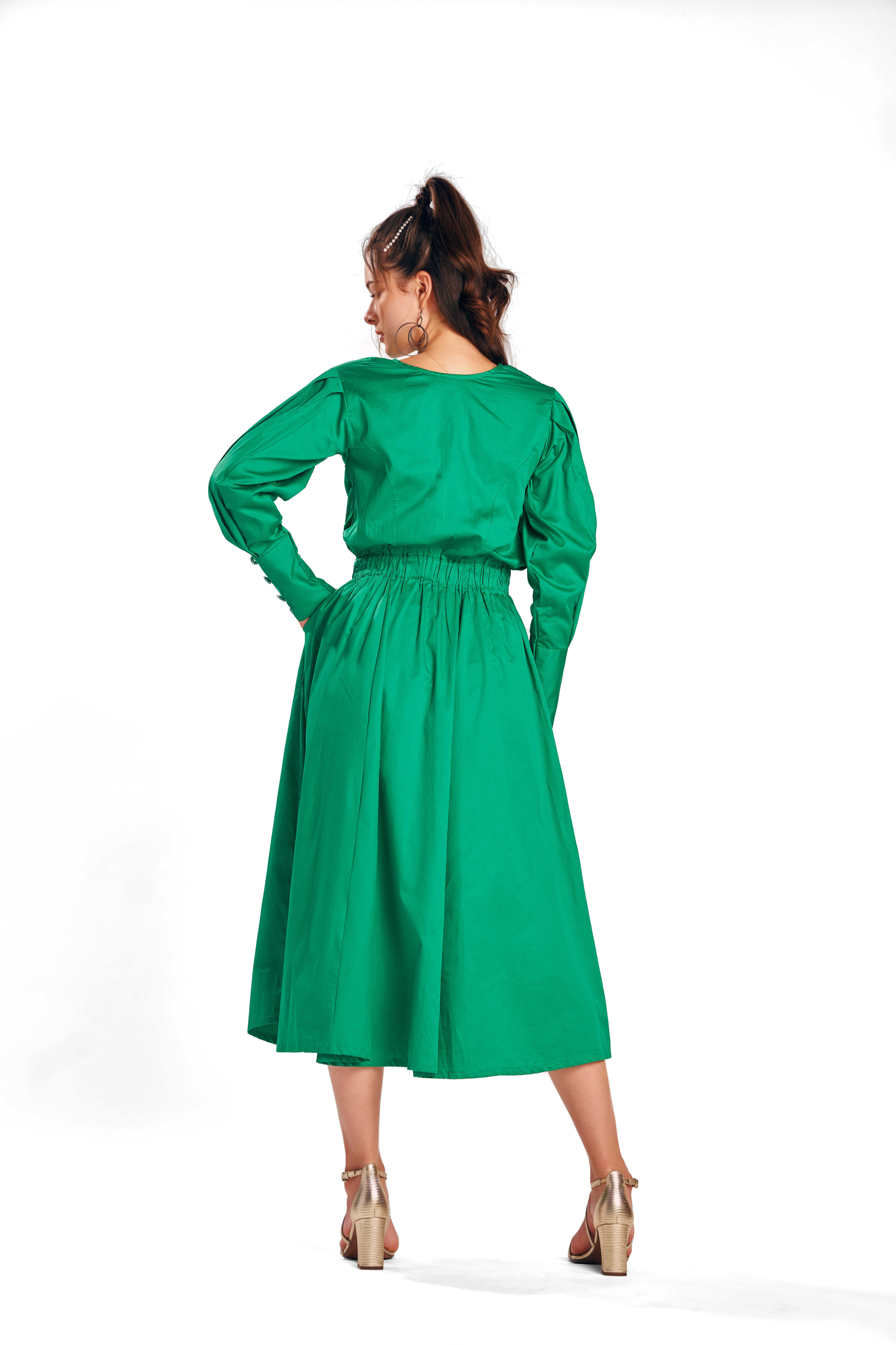 A model showcasing Alcedo Bird Green Dress by Zilaire from Zilaire's collection