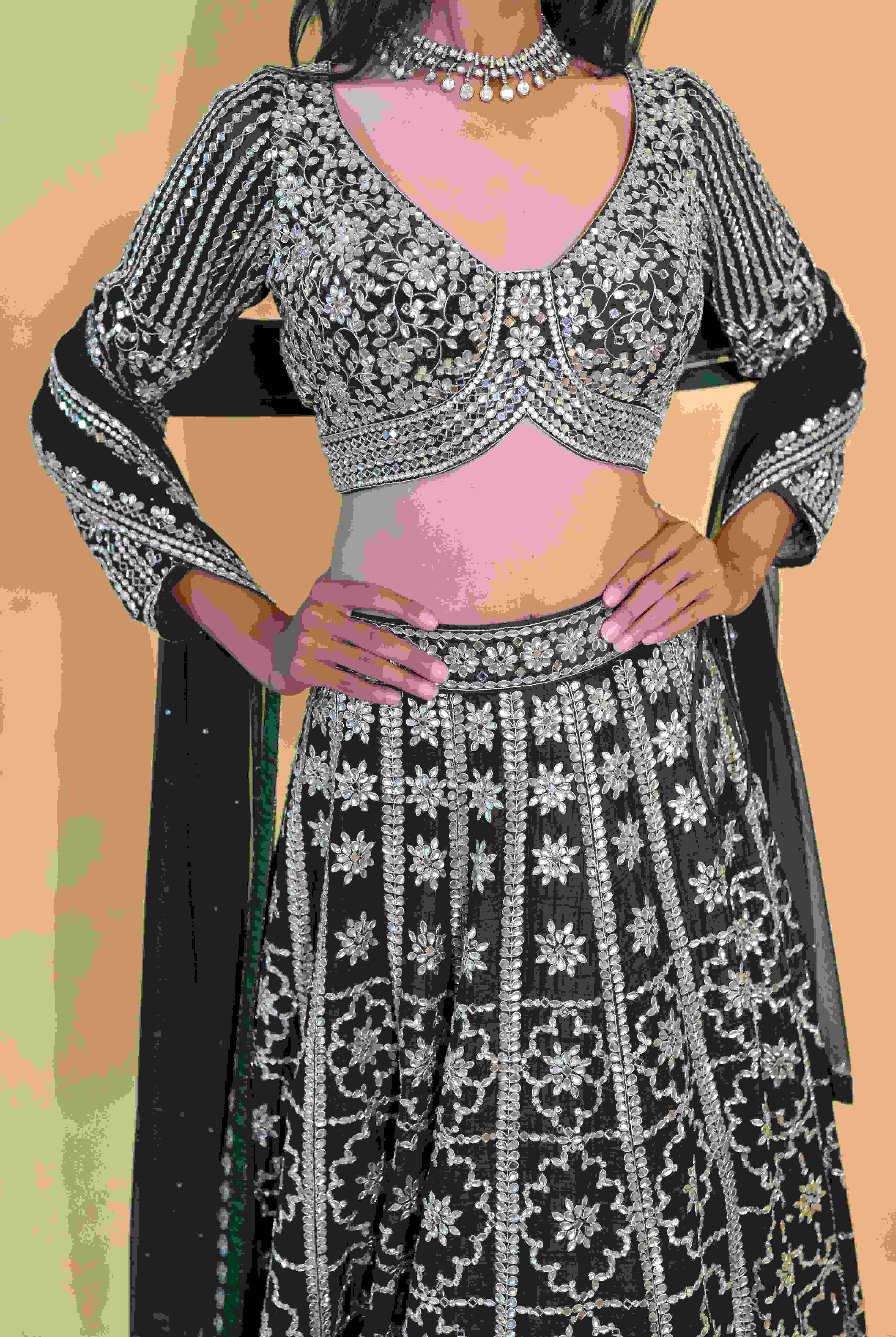 A model showcasing Green Lehenga Choli Set by Labell Patchouli from Labell Patchouli's collection A model showcasing Green Lehenga Choli Set by Labell Patchouli from Labell Patchouli's collection