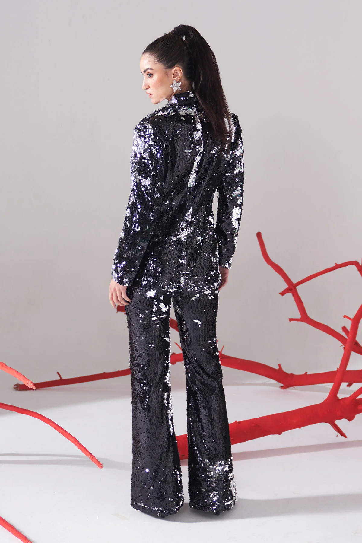 A model showcasing Shaded Blaq Sequence Blazer Set by Puneet Kapoor Label from Puneet Kapoor Label's collection A model showcasing Shaded Blaq Sequence Blazer Set by Puneet Kapoor Label from Puneet Kapoor Label's collection