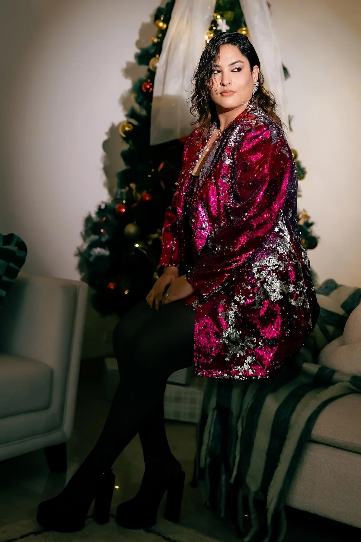 A model showcasing Shaded Dolce Pink Sequence Blazer by Puneet Kapoor Label from Puneet Kapoor Label's collection A model showcasing Shaded Dolce Pink Sequence Blazer by Puneet Kapoor Label from Puneet Kapoor Label's collection