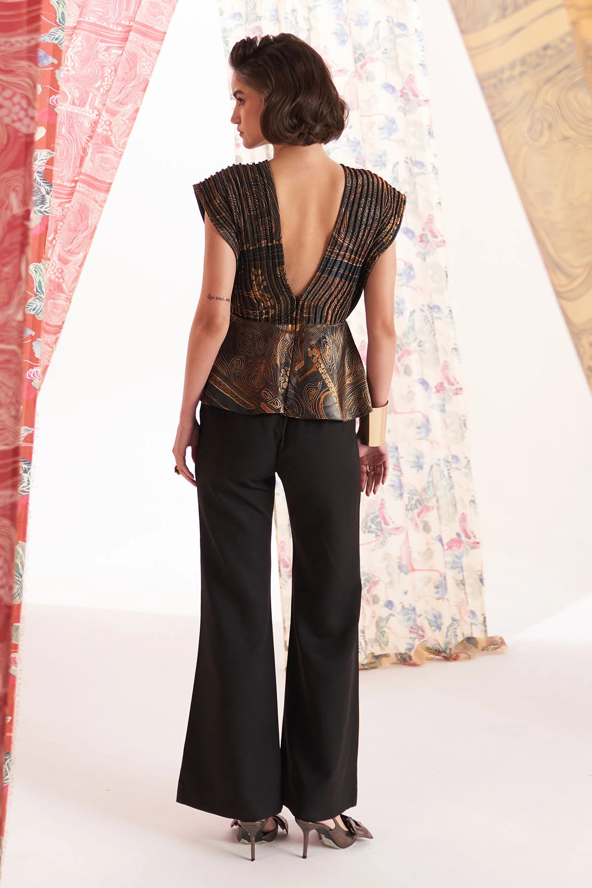 A model showcasing Zebradori Jumpsuit by Puneet Kapoor Label from Puneet Kapoor Label's collection A model showcasing Zebradori Jumpsuit by Puneet Kapoor Label from Puneet Kapoor Label's collection