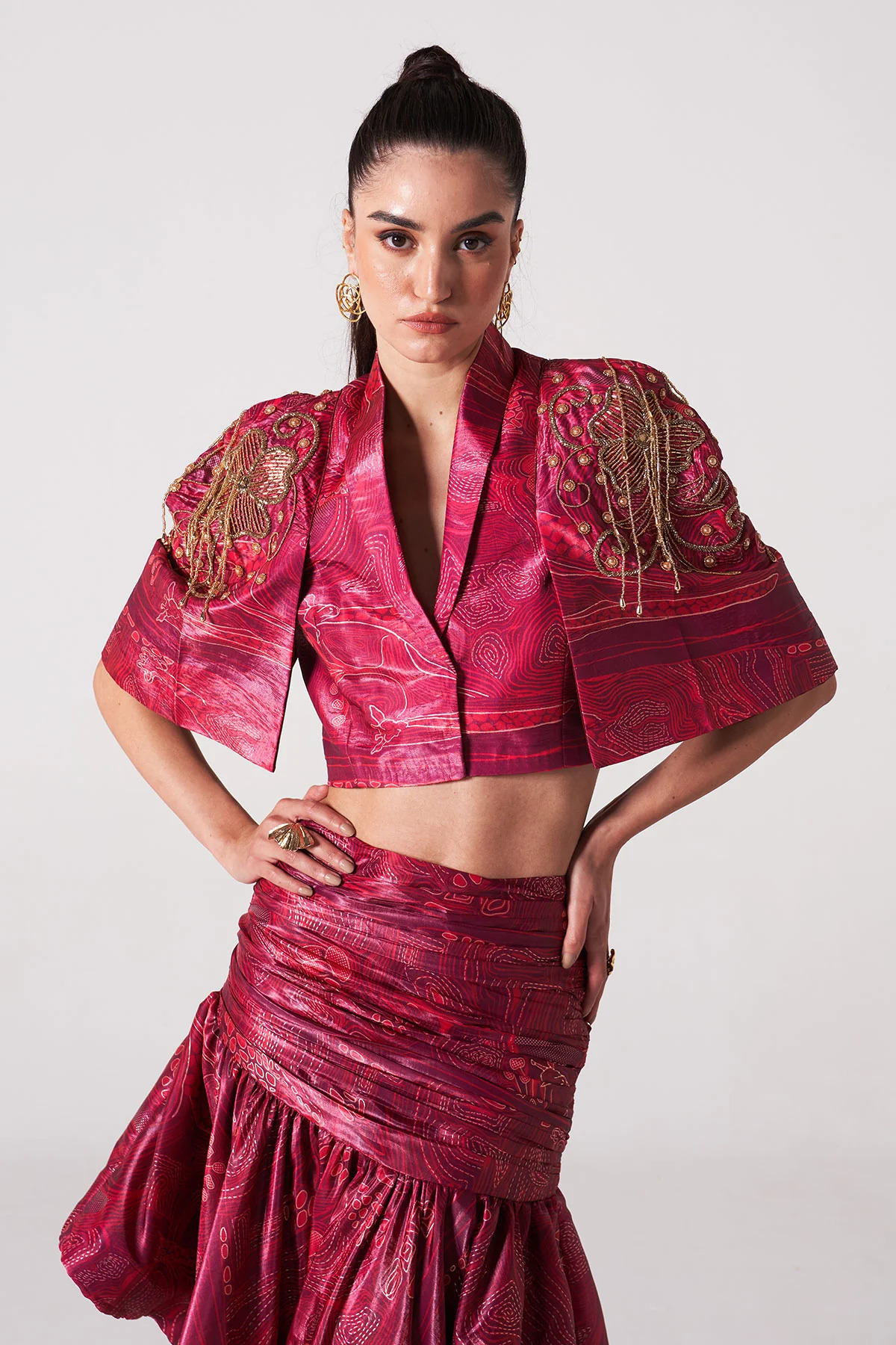 A model showcasing Fuchsia Zebra Print Slit Jacket With Ruffle Skirt by Puneet Kapoor Label from Puneet Kapoor Label's collection