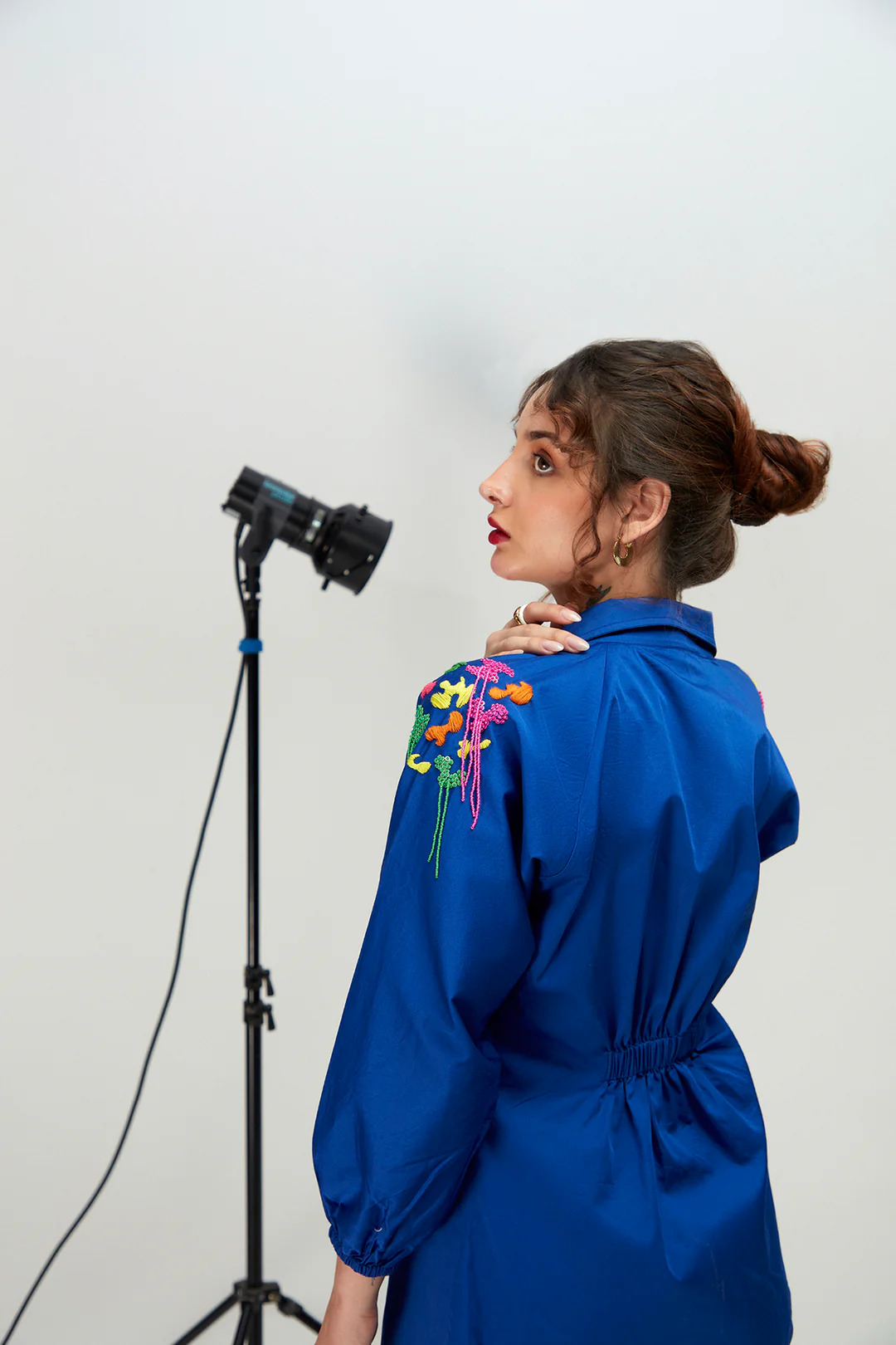 A model showcasing Bubble Gum Blue Shirt by Zilaire from Zilaire's collection