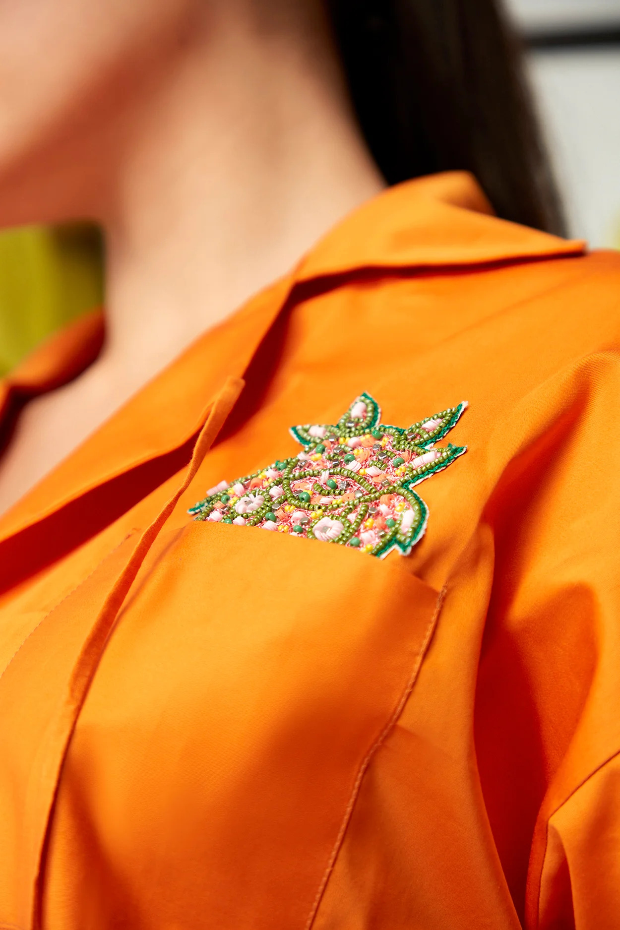 A model showcasing Blaze Orange Burst Set by Zilaire from Zilaire's collection A model showcasing Blaze Orange Burst Set by Zilaire from Zilaire's collection