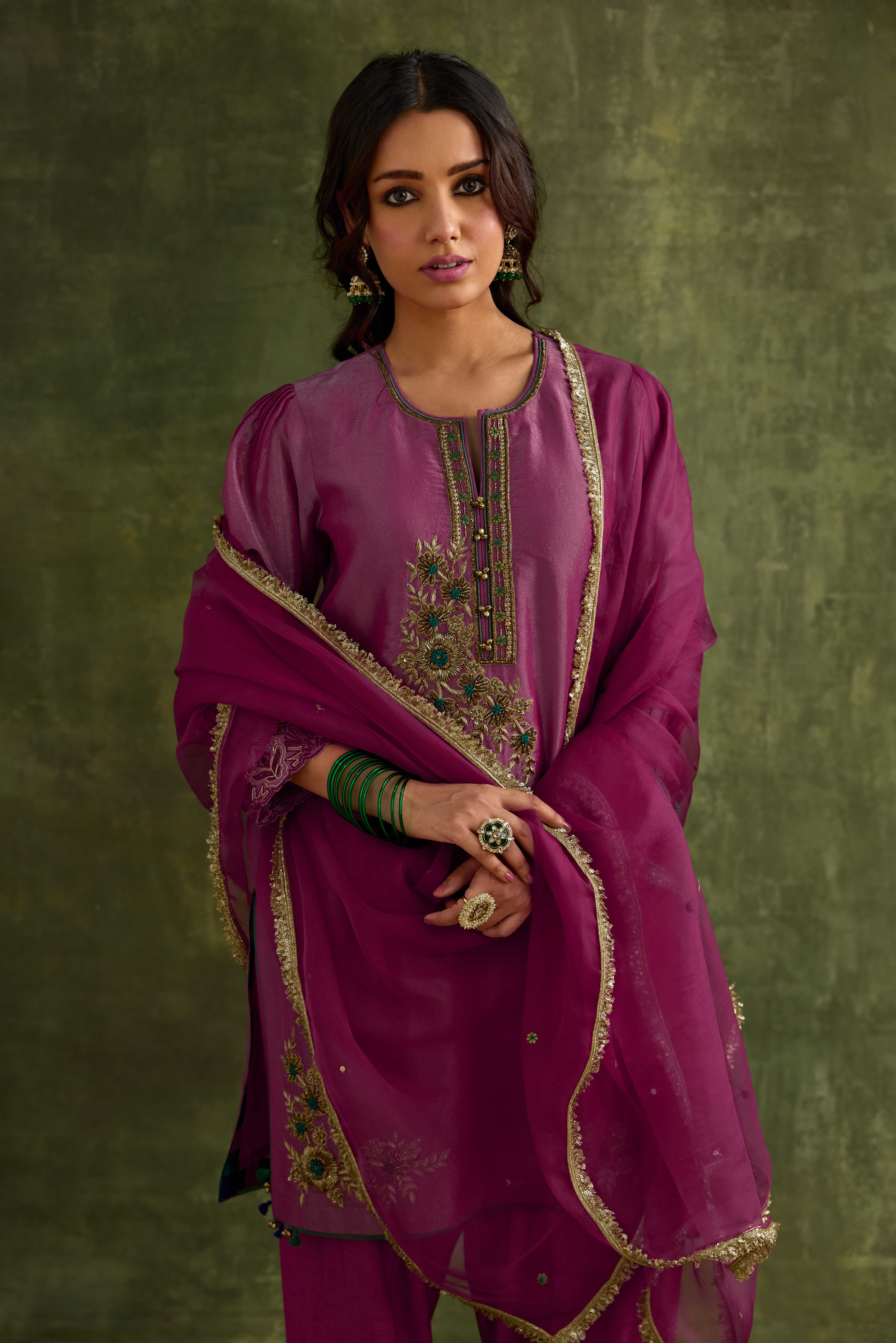 A model showcasing Heer Short Kurta Salwar Set by Nirvair from Nirvair's collection