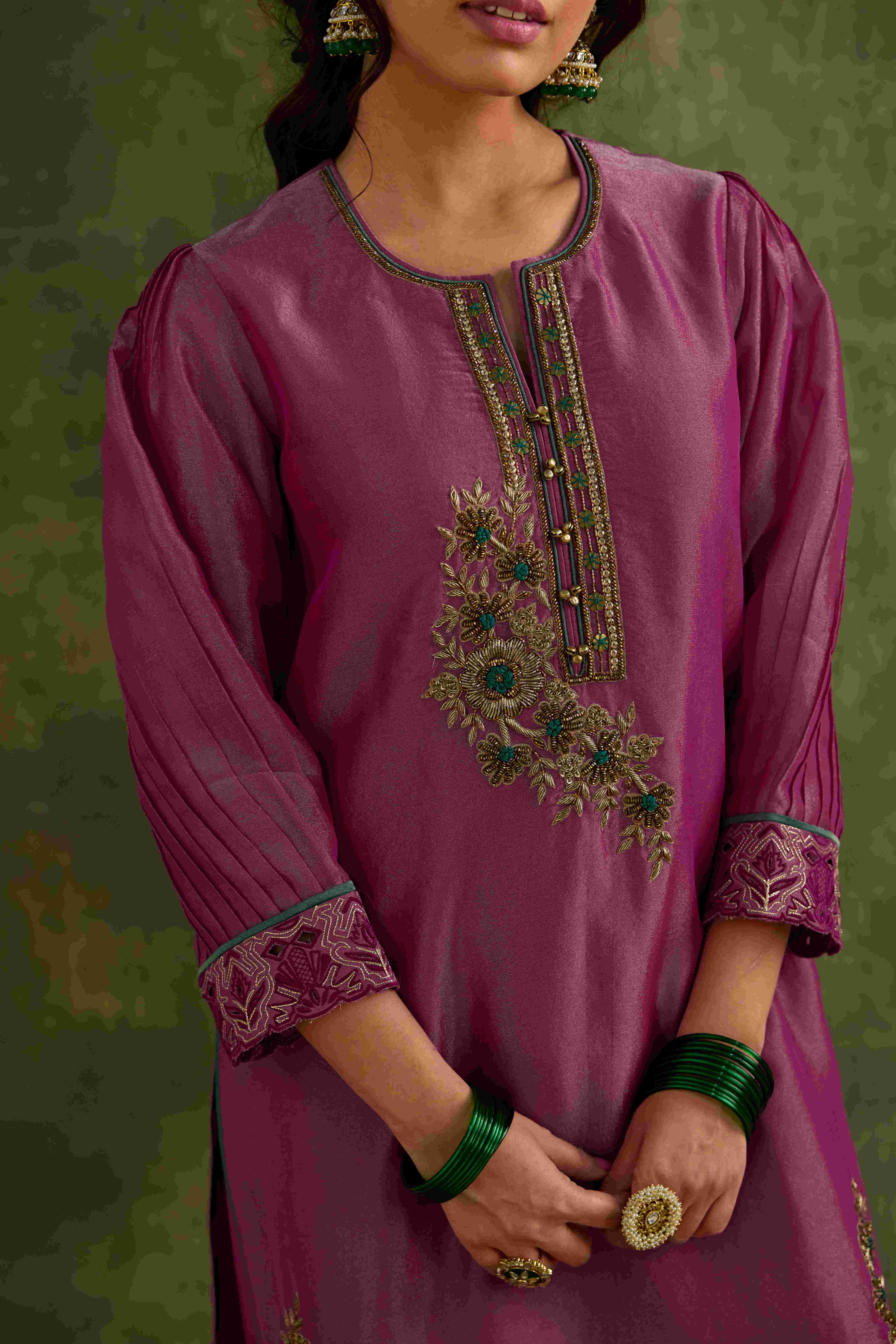 A model showcasing Heer Short Kurta Salwar Set by Nirvair from Nirvair's collection