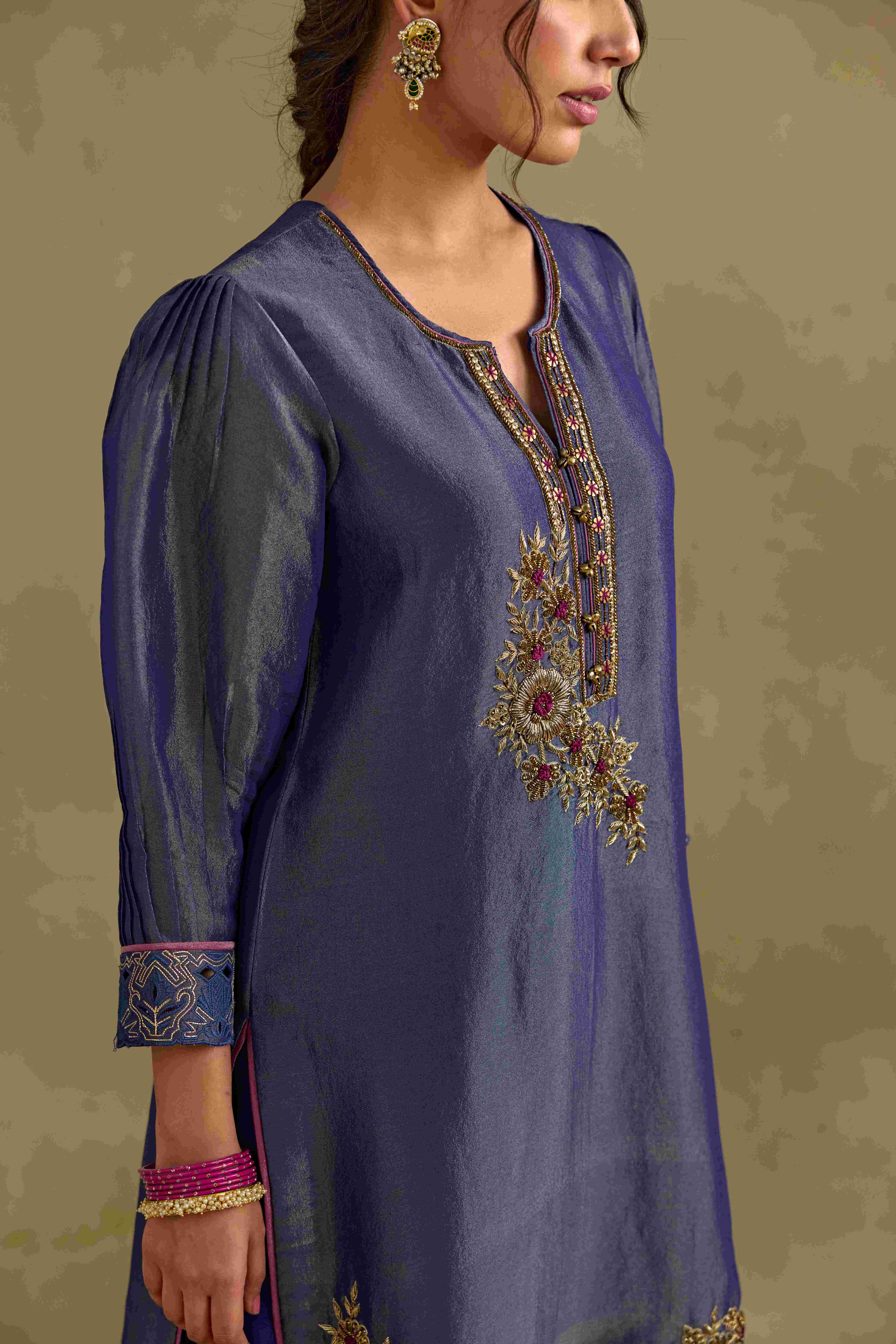 A model showcasing Heer Blue Short Kurta Salwar Set by Nirvair from Nirvair's collection