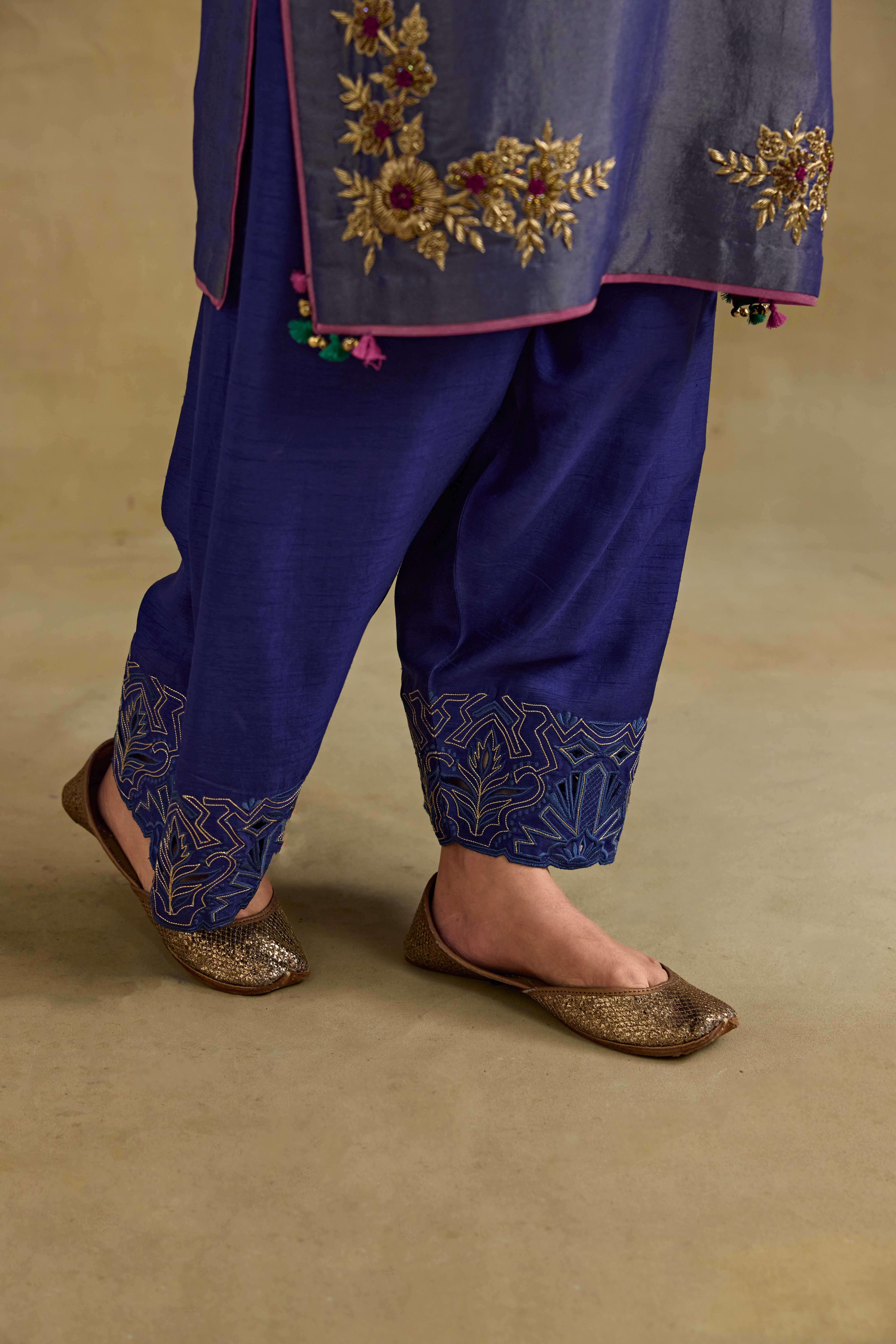 A model showcasing Heer Blue Short Kurta Salwar Set by Nirvair from Nirvair's collection