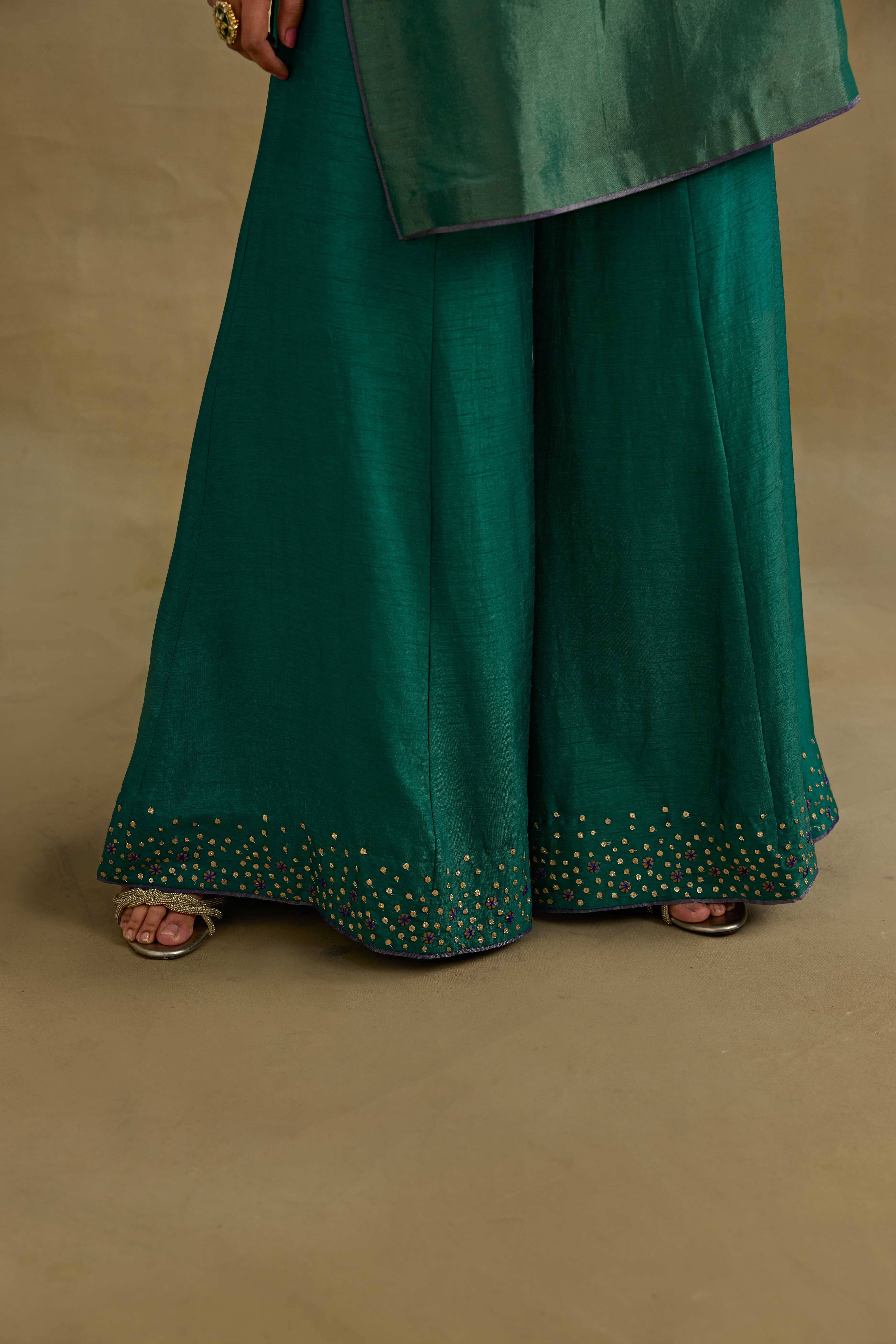 A model showcasing Prisha Green Short Kurta Garara Set by Nirvair from Nirvair's collection