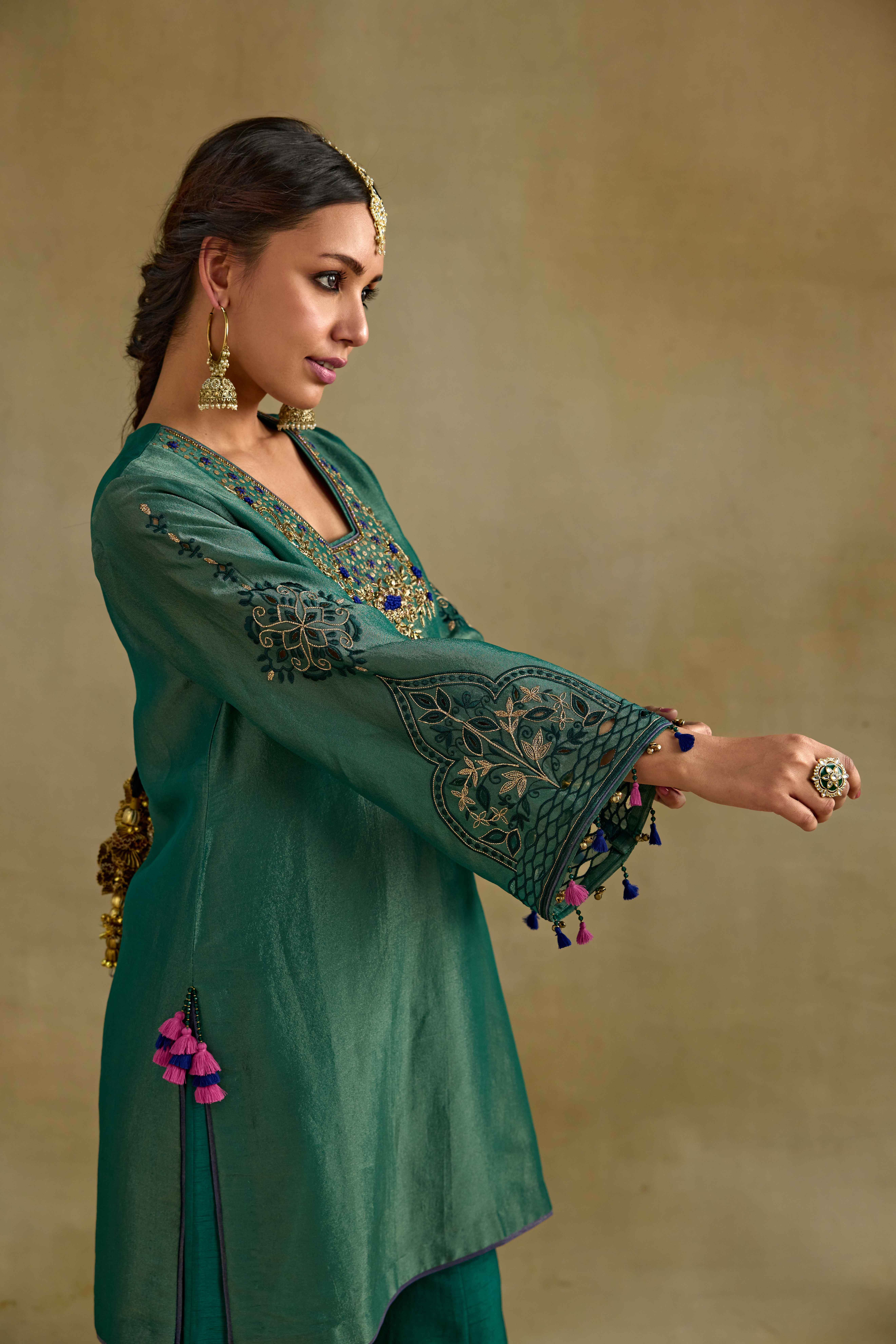 A model showcasing Prisha Green Short Kurta Garara Set by Nirvair from Nirvair's collection