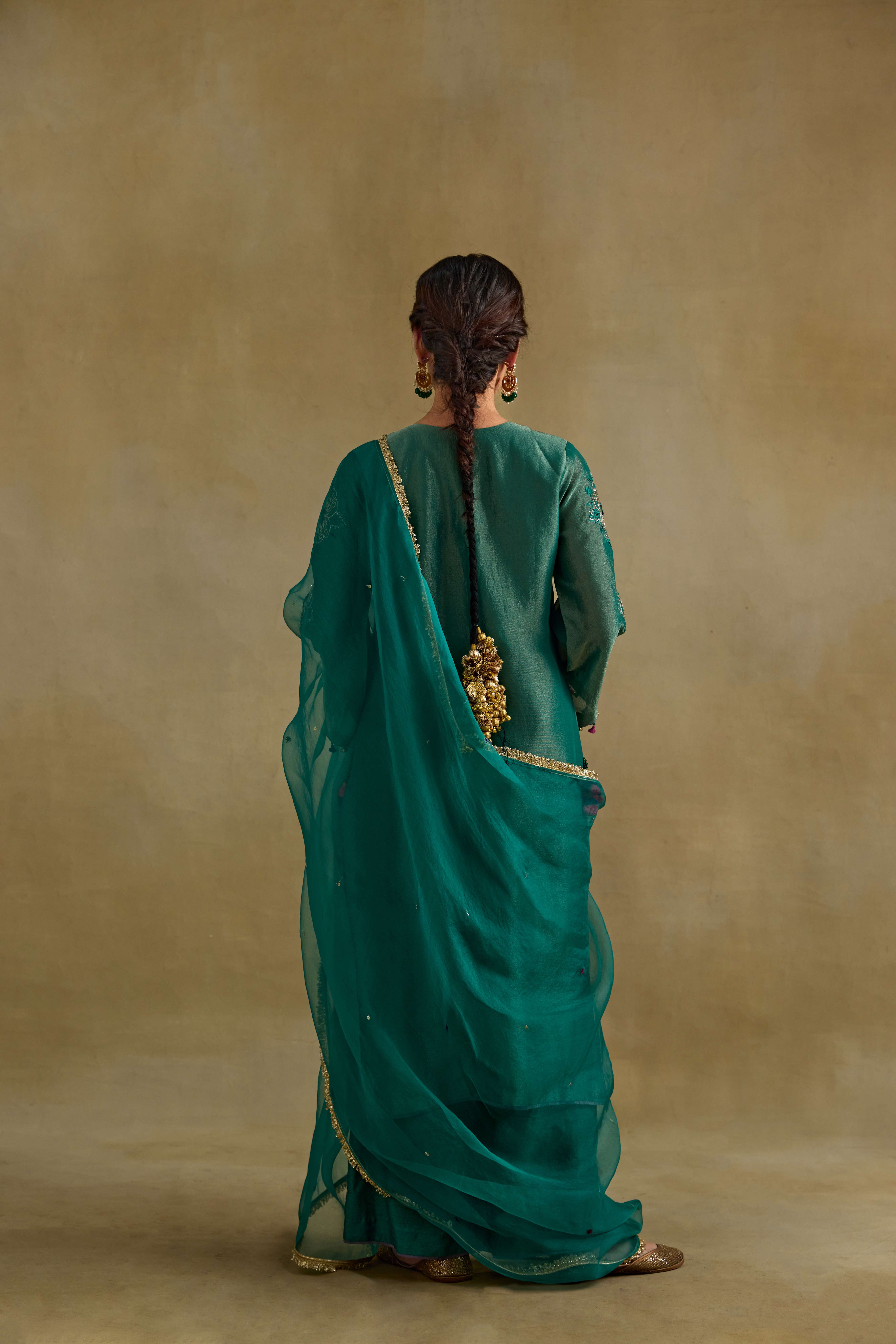 A model showcasing Anam Green Dupatta by Nirvair from Nirvair's collection A model showcasing Anam Green Dupatta by Nirvair from Nirvair's collection