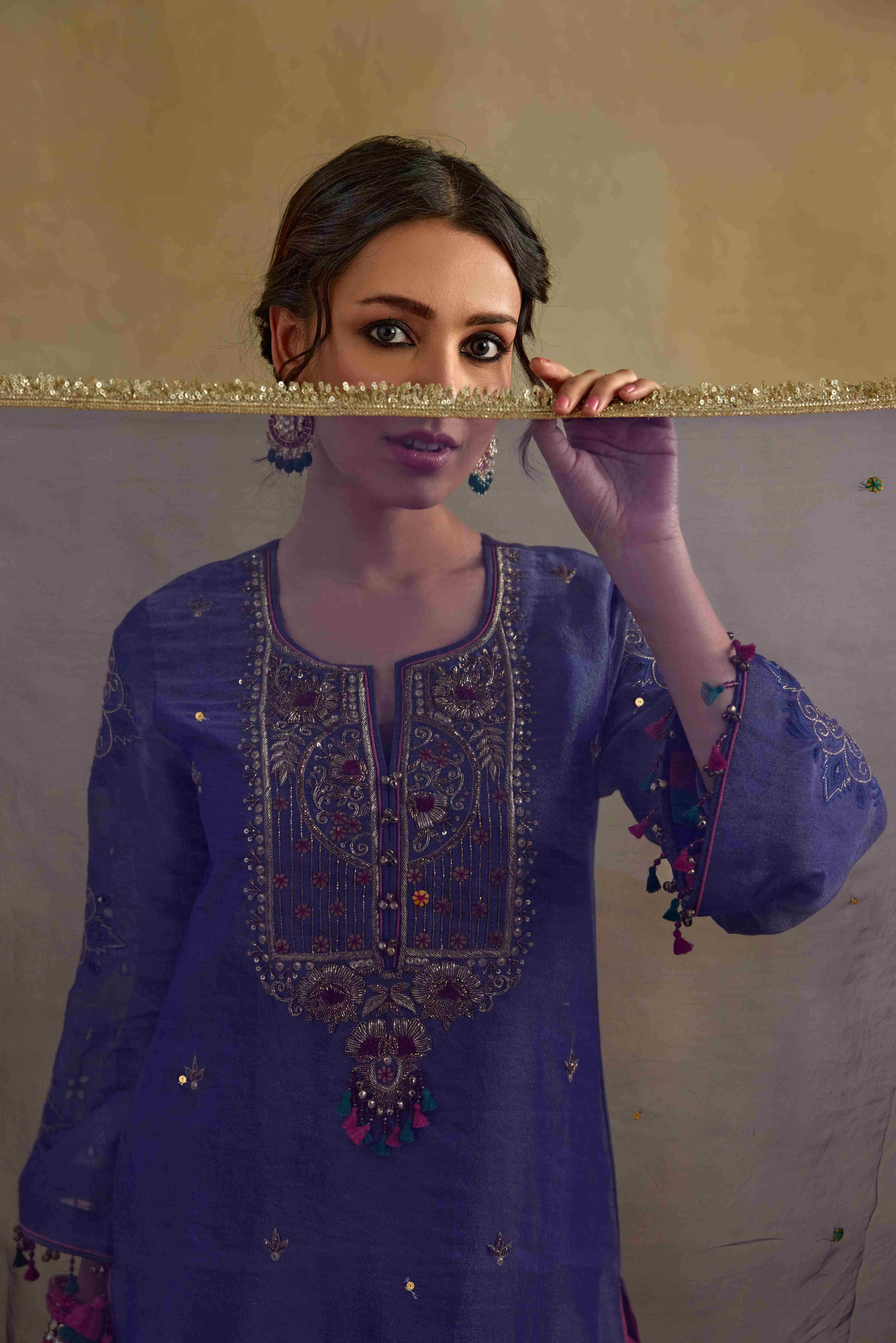 A model showcasing Anam Organza Blue Dupatta by Nirvair from Nirvair's collection A model showcasing Anam Organza Blue Dupatta by Nirvair from Nirvair's collection
