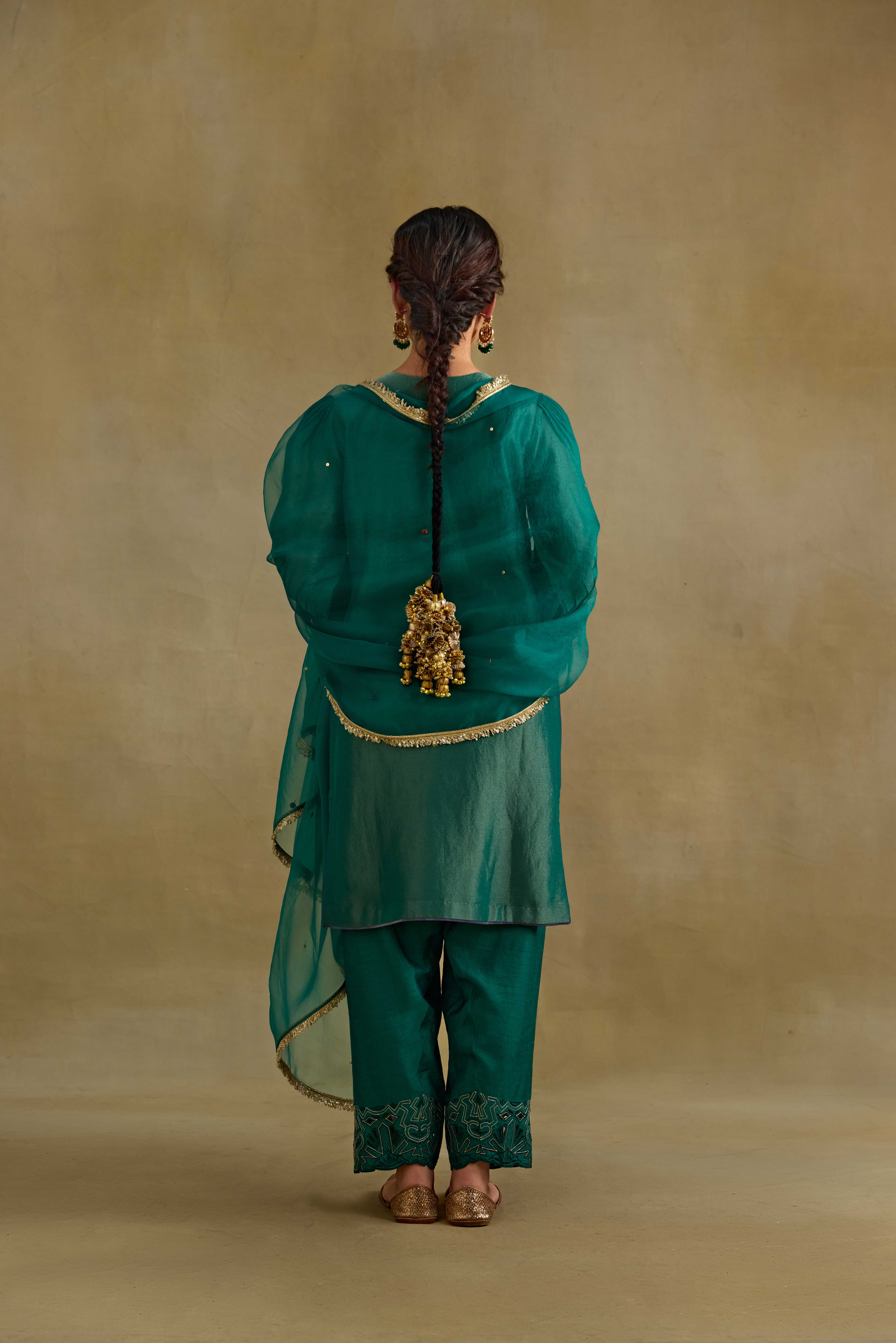A model showcasing Heer Green Organza Dupatta by Nirvair from Nirvair's collection A model showcasing Heer Green Organza Dupatta by Nirvair from Nirvair's collection