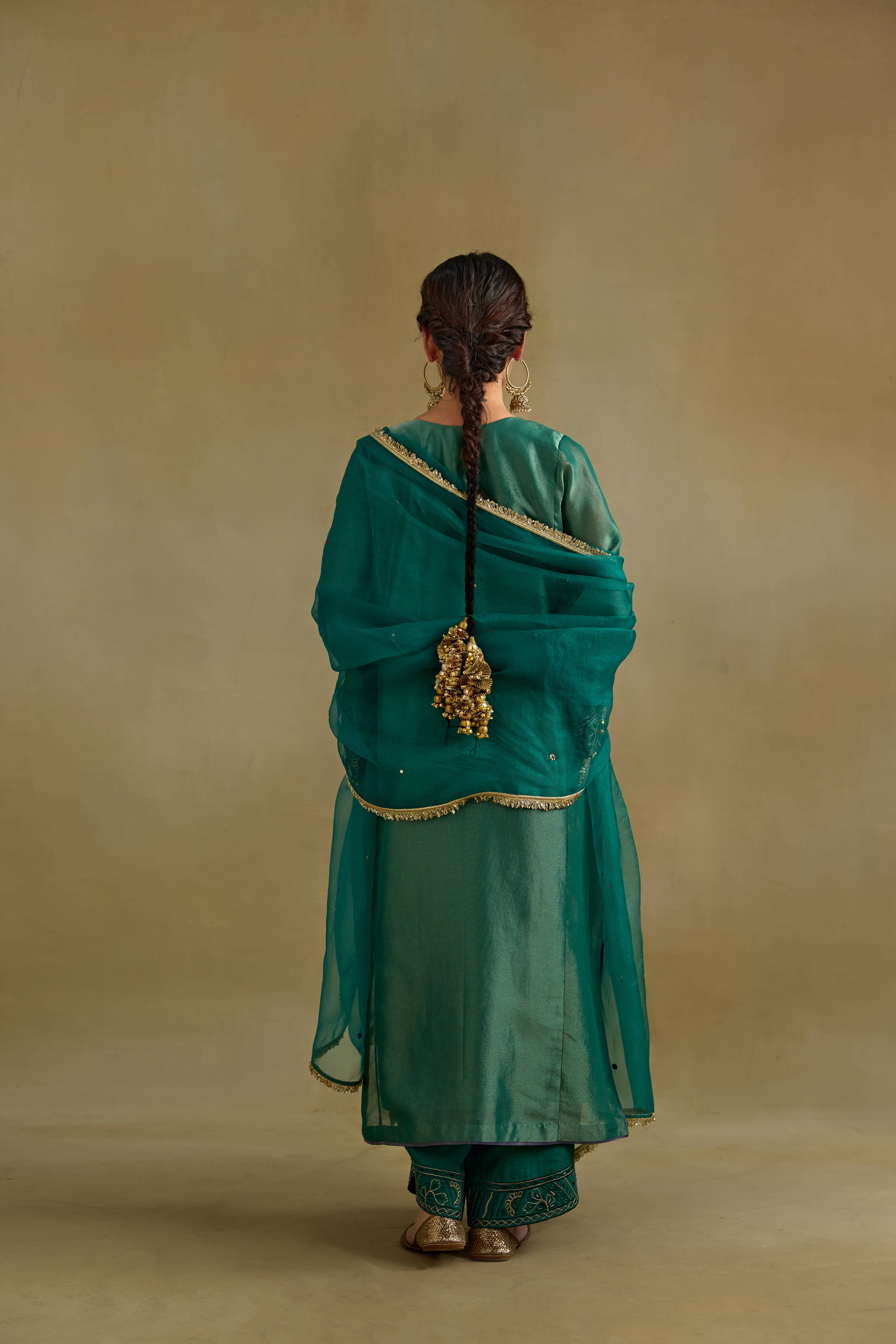 A model showcasing Amber Green Dupatta by Nirvair from Nirvair's collection A model showcasing Amber Green Dupatta by Nirvair from Nirvair's collection