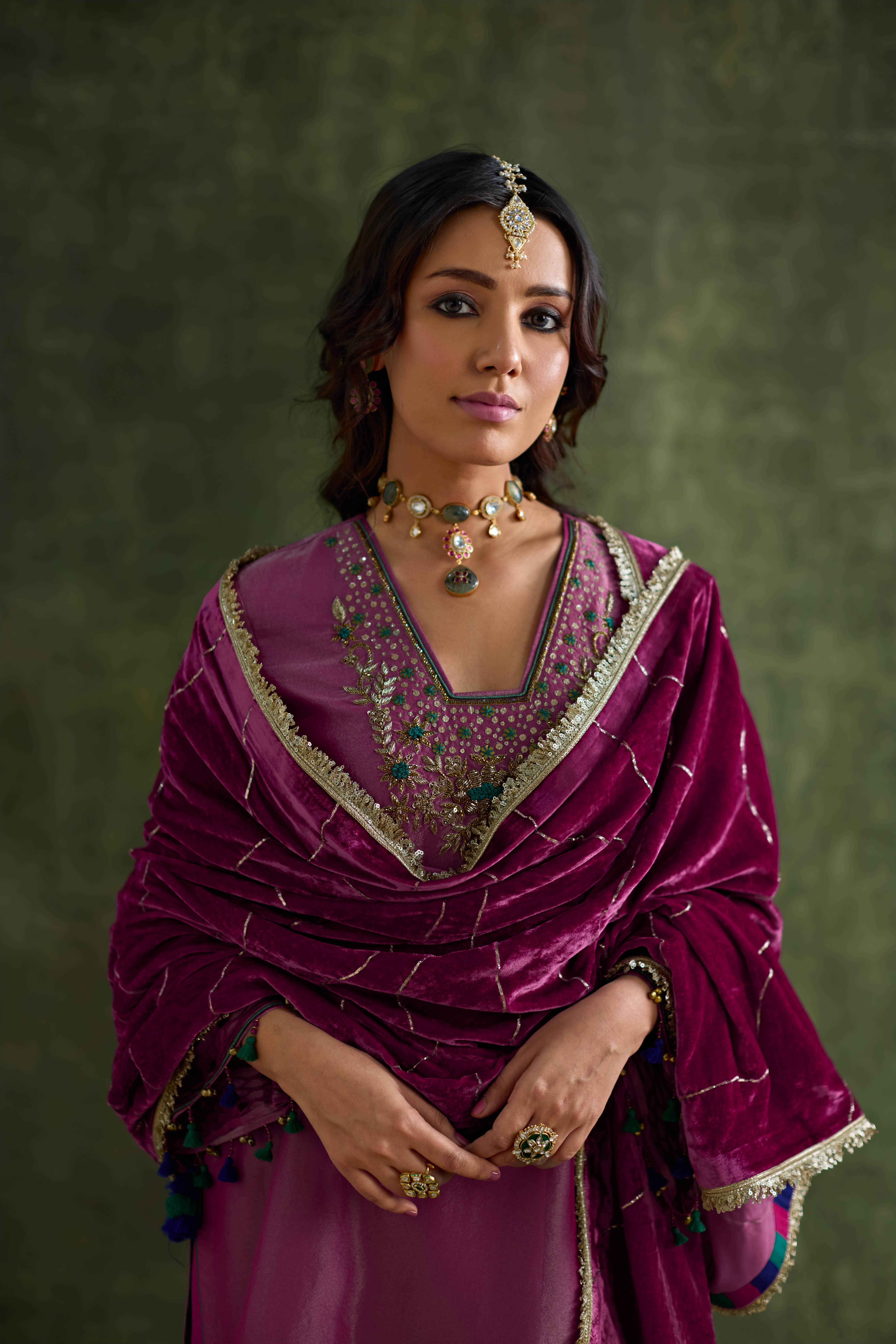 A model showcasing Prisha Velvet Pink Shawl by Nirvair from Nirvair's collection