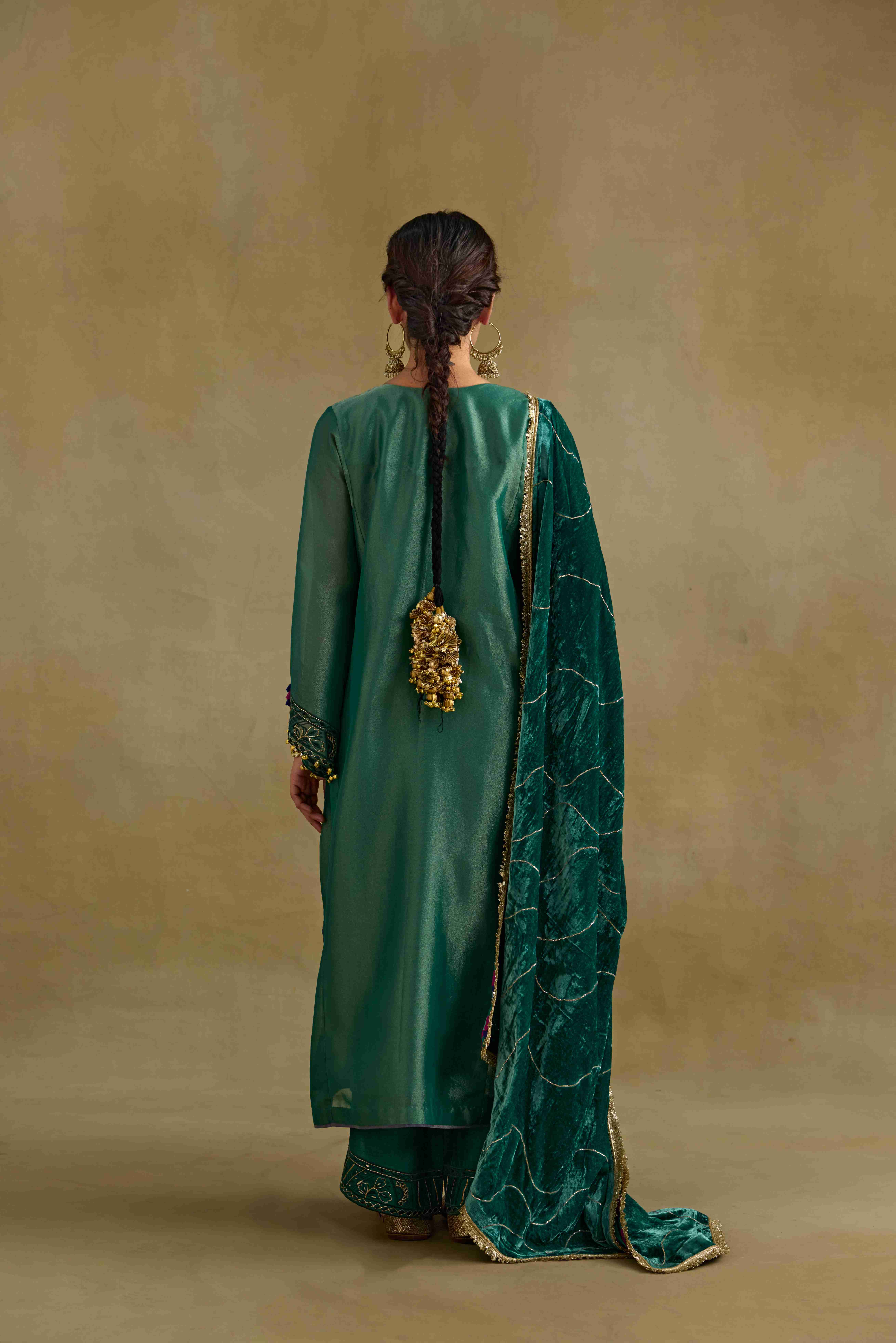 A model showcasing Amber Green Shawl by Nirvair from Nirvair's collection A model showcasing Amber Green Shawl by Nirvair from Nirvair's collection