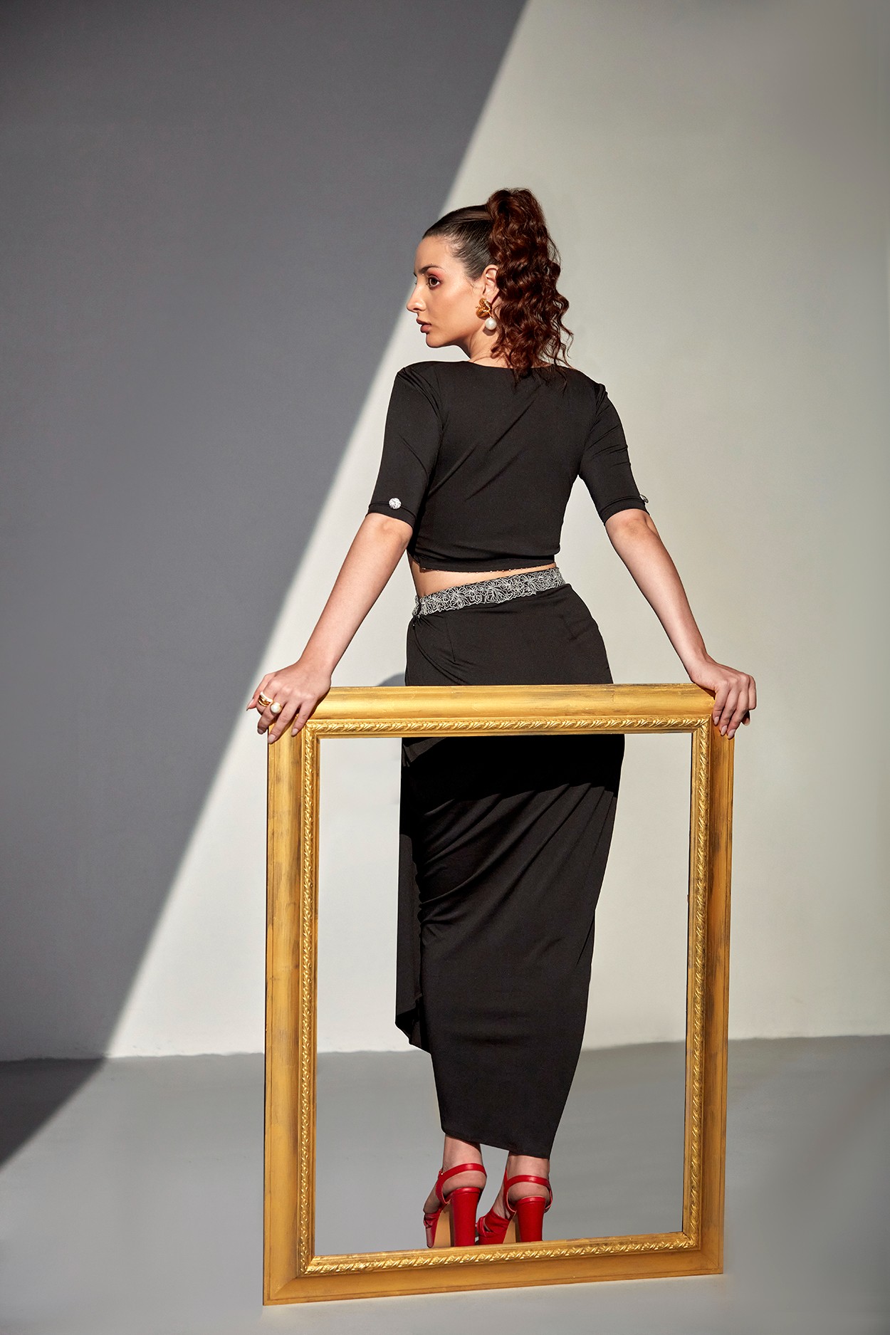 A model showcasing Midnight Meadow Black Set by Zilaire from Zilaire's collection
