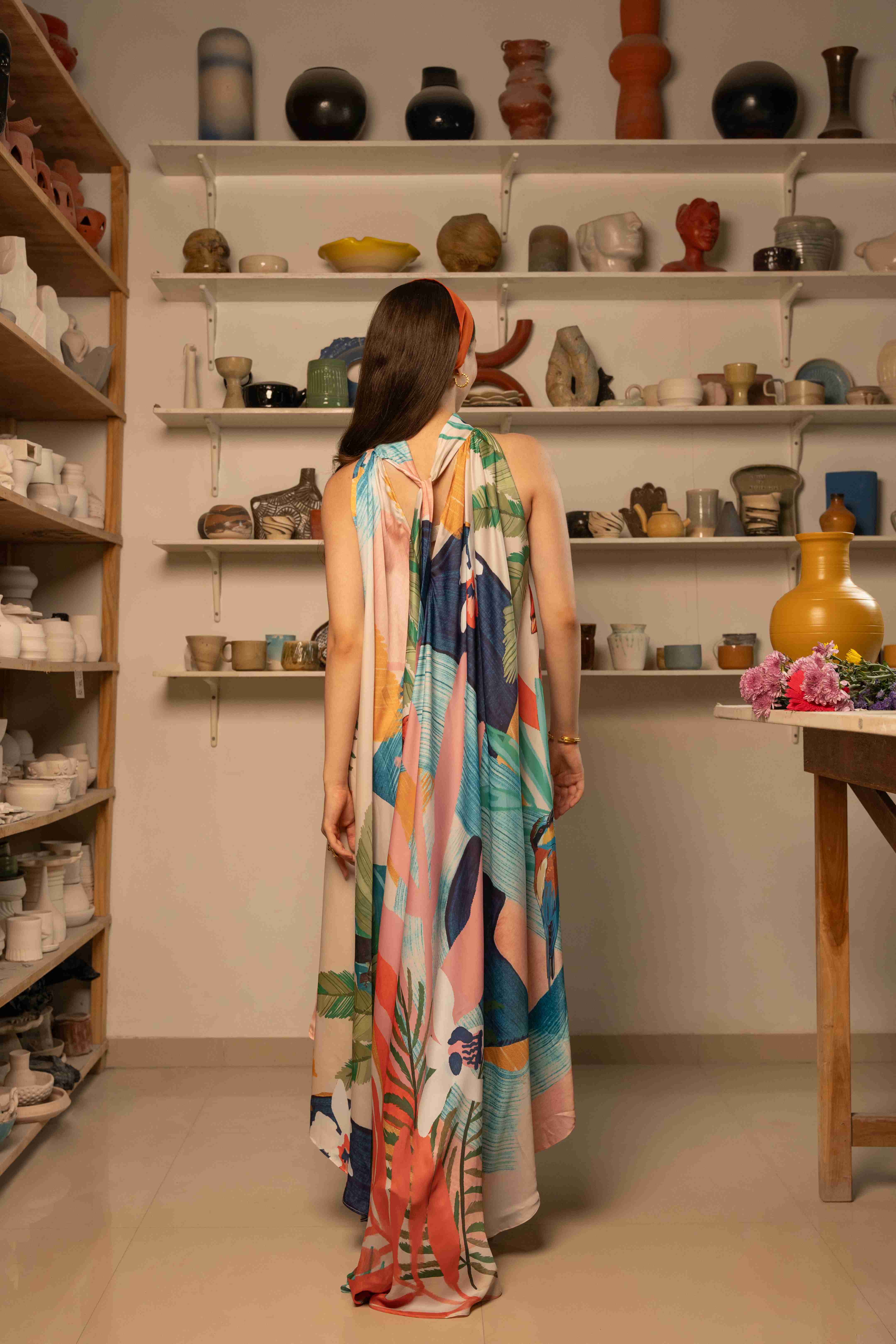 A model showcasing Selam Halter Neck Dress by Zilaire from Zilaire's collection