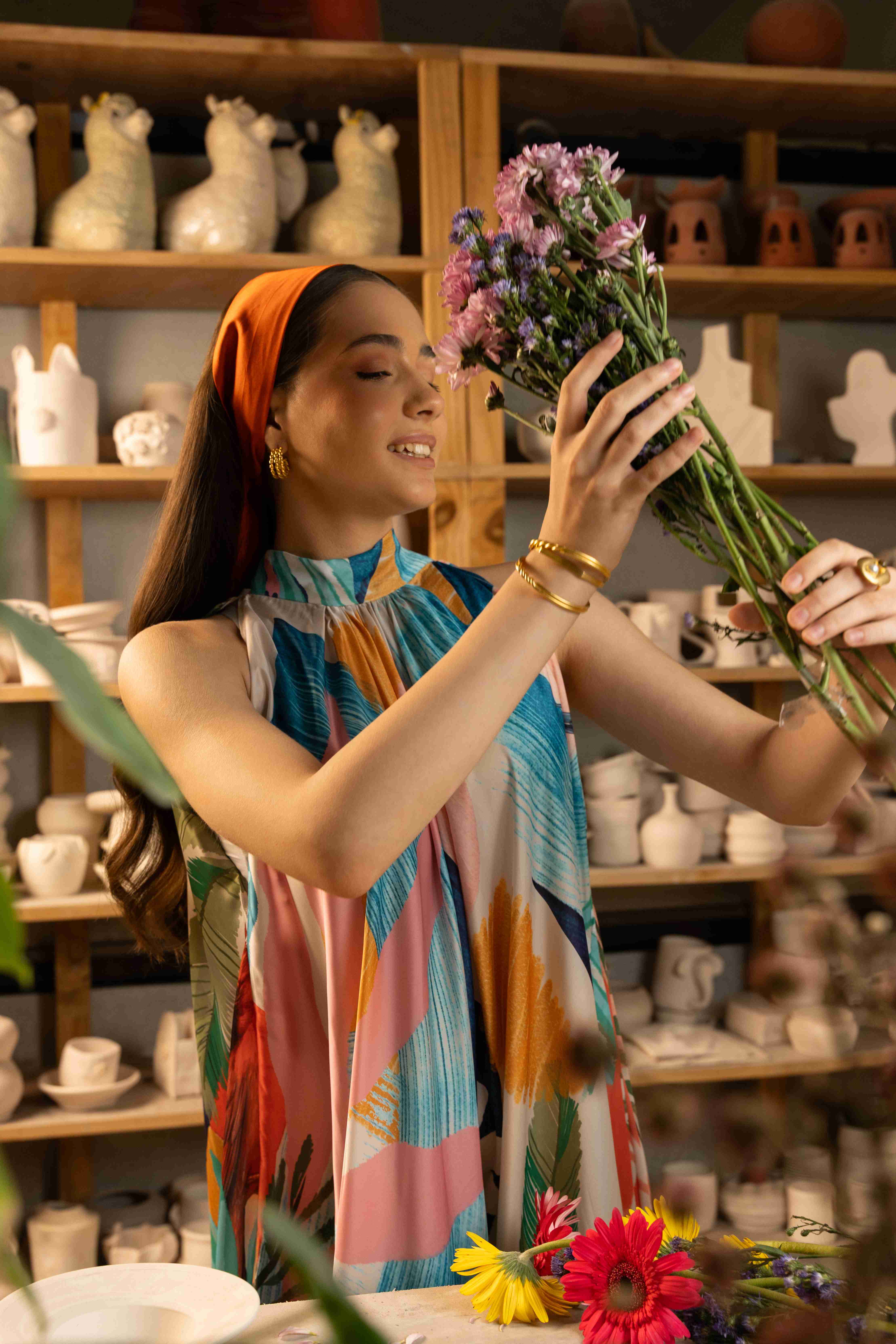 A model showcasing Selam Halter Neck Dress by Zilaire from Zilaire's collection