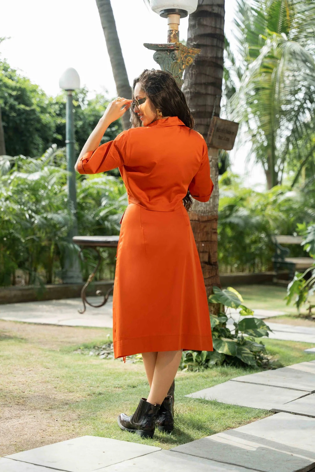 A model showcasing Misha Orange Coord Set by Zilaire from Zilaire's collection