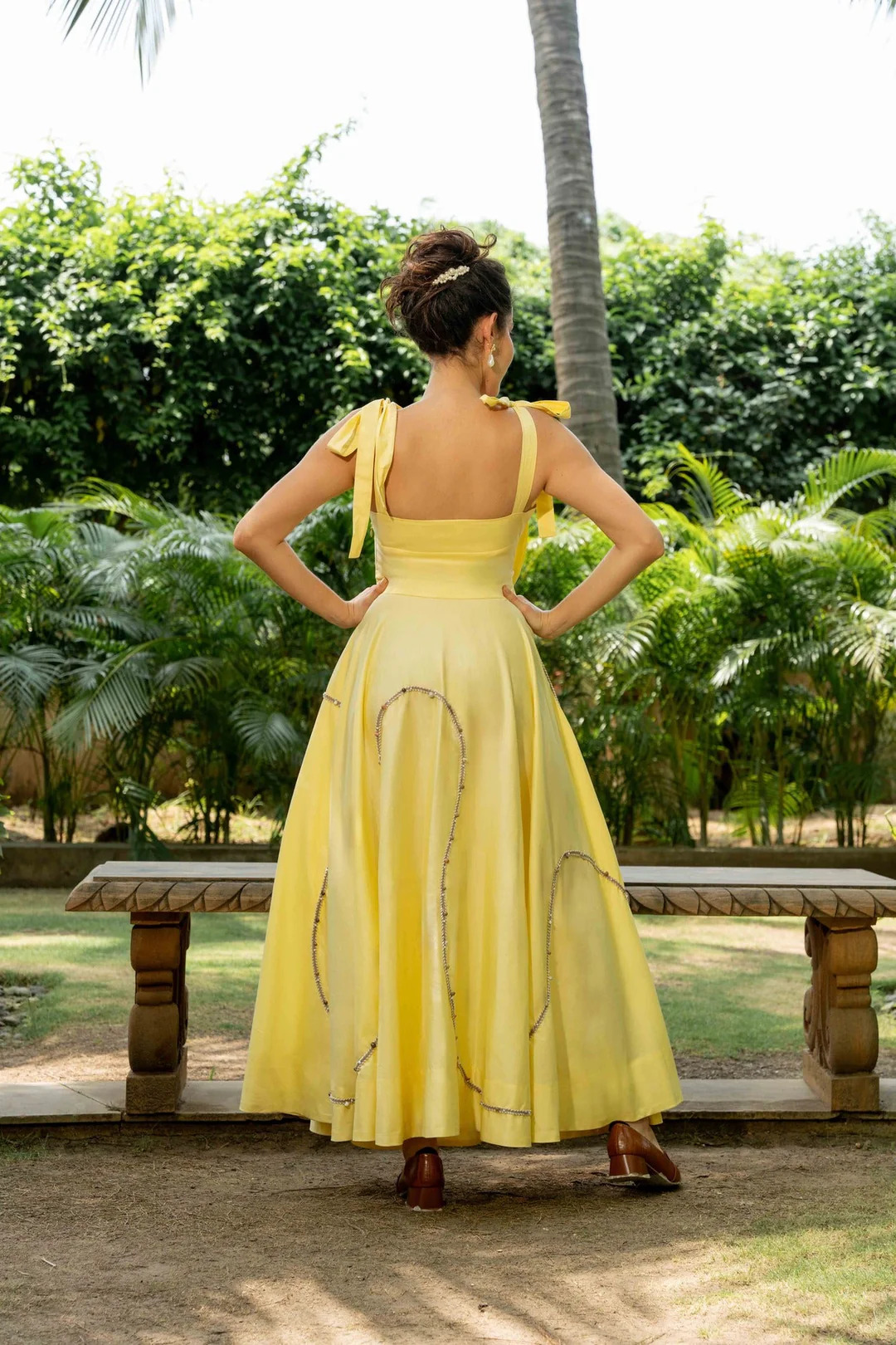 A model showcasing Maple Yellow Cotton Set by Zilaire from Zilaire's collection