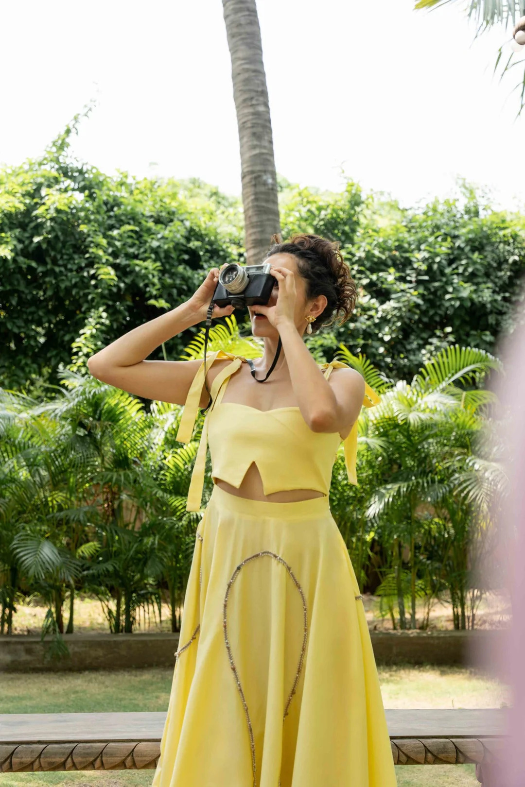 A model showcasing Maple Yellow Cotton Set by Zilaire from Zilaire's collection