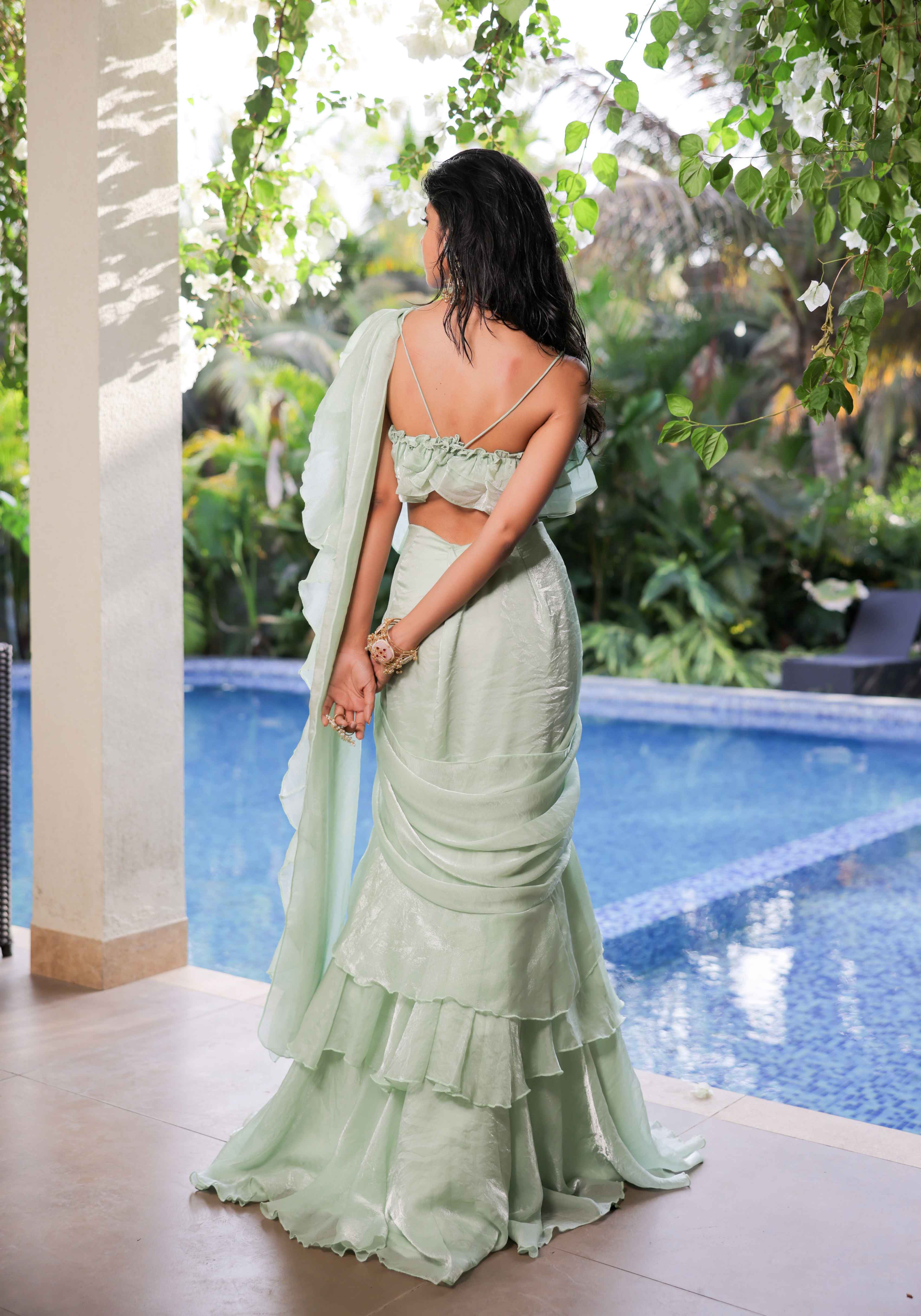 A model showcasing Mint Green Ruffle Draped Saree Set by Foram Patel from Foram Patel's collection