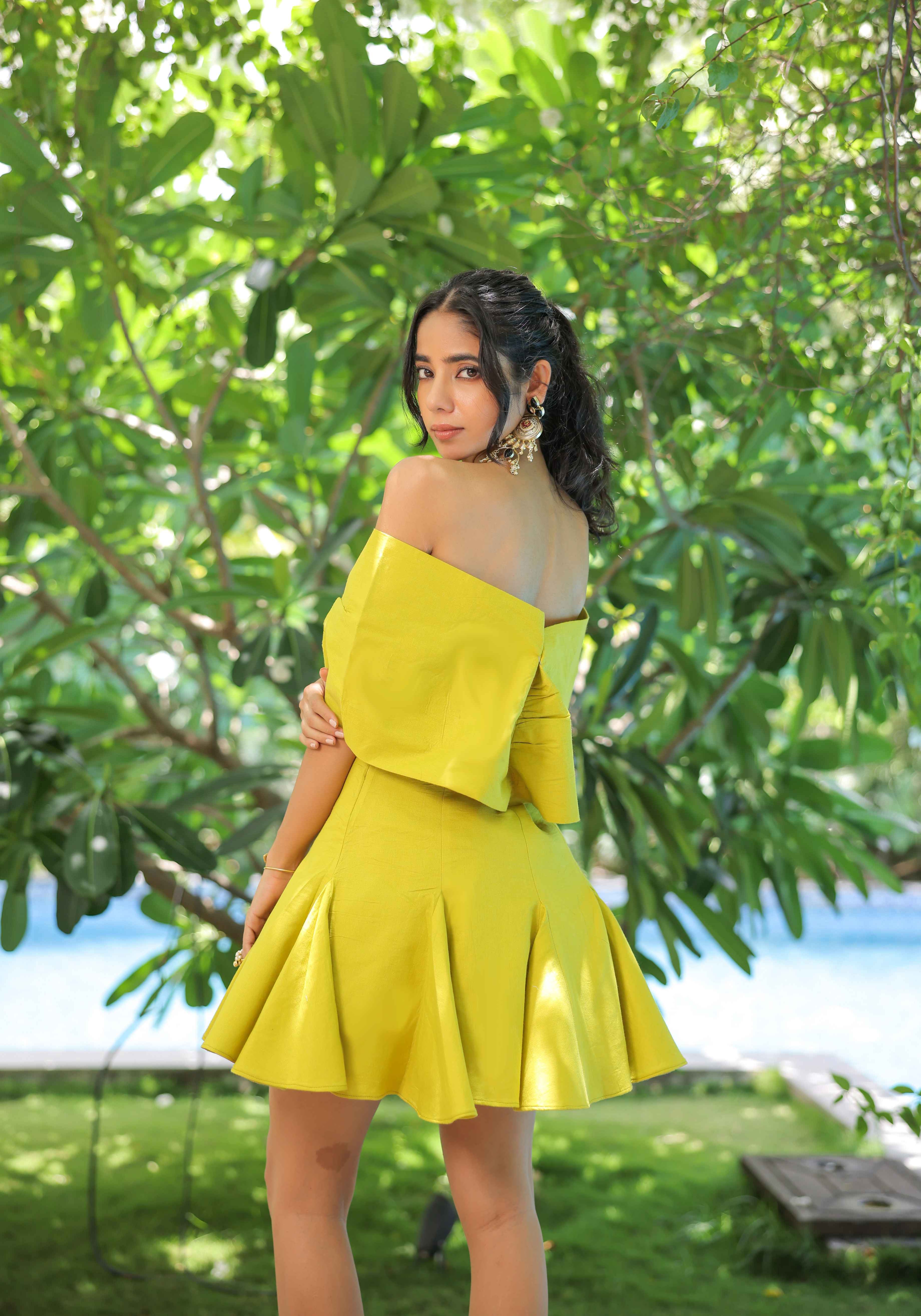 A model showcasing Lime Green Bow Dress by Foram Patel from Foram Patel's collection