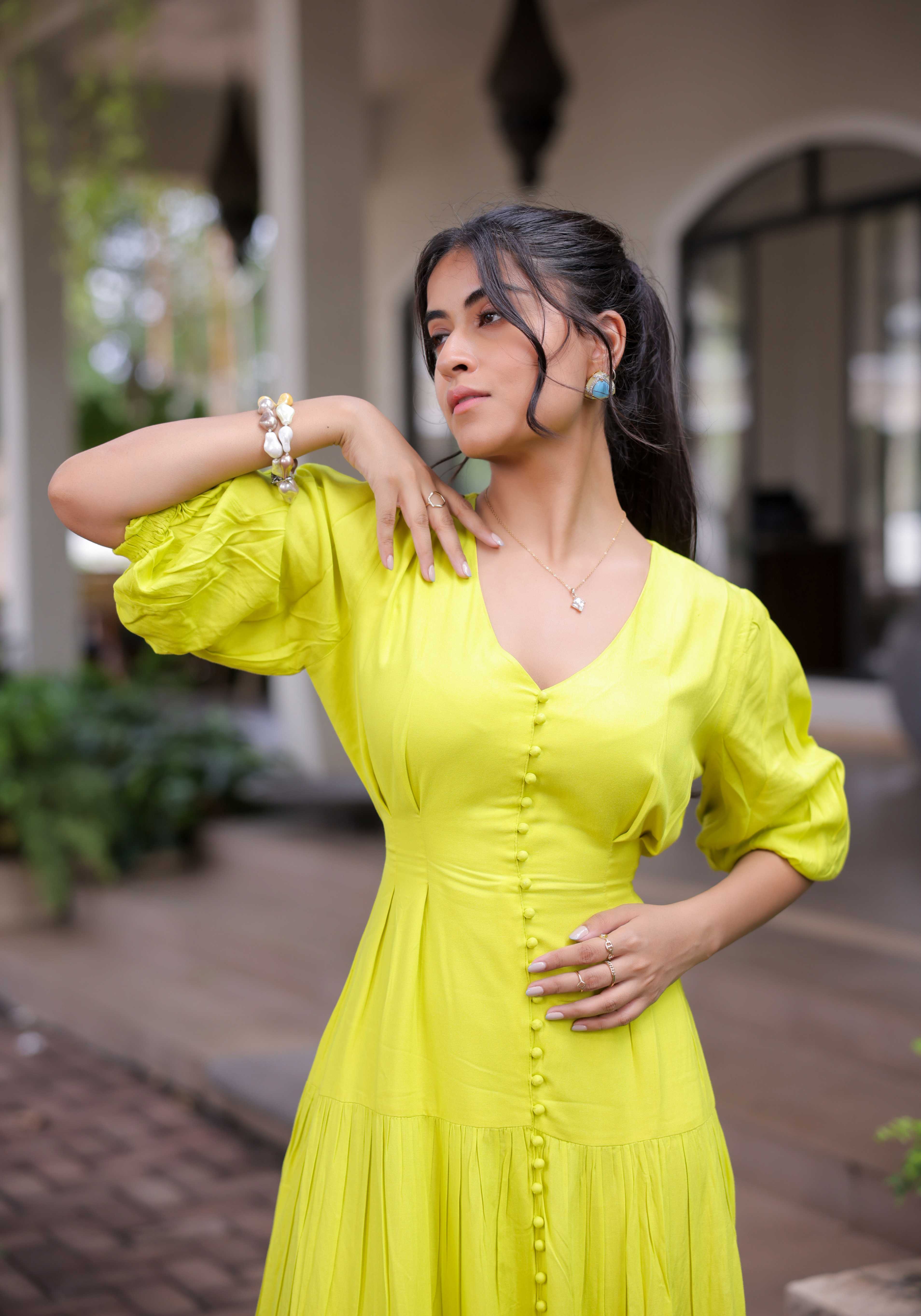 A model showcasing Lime Green Tiered Maxi Dress by Foram Patel from Foram Patel's collection