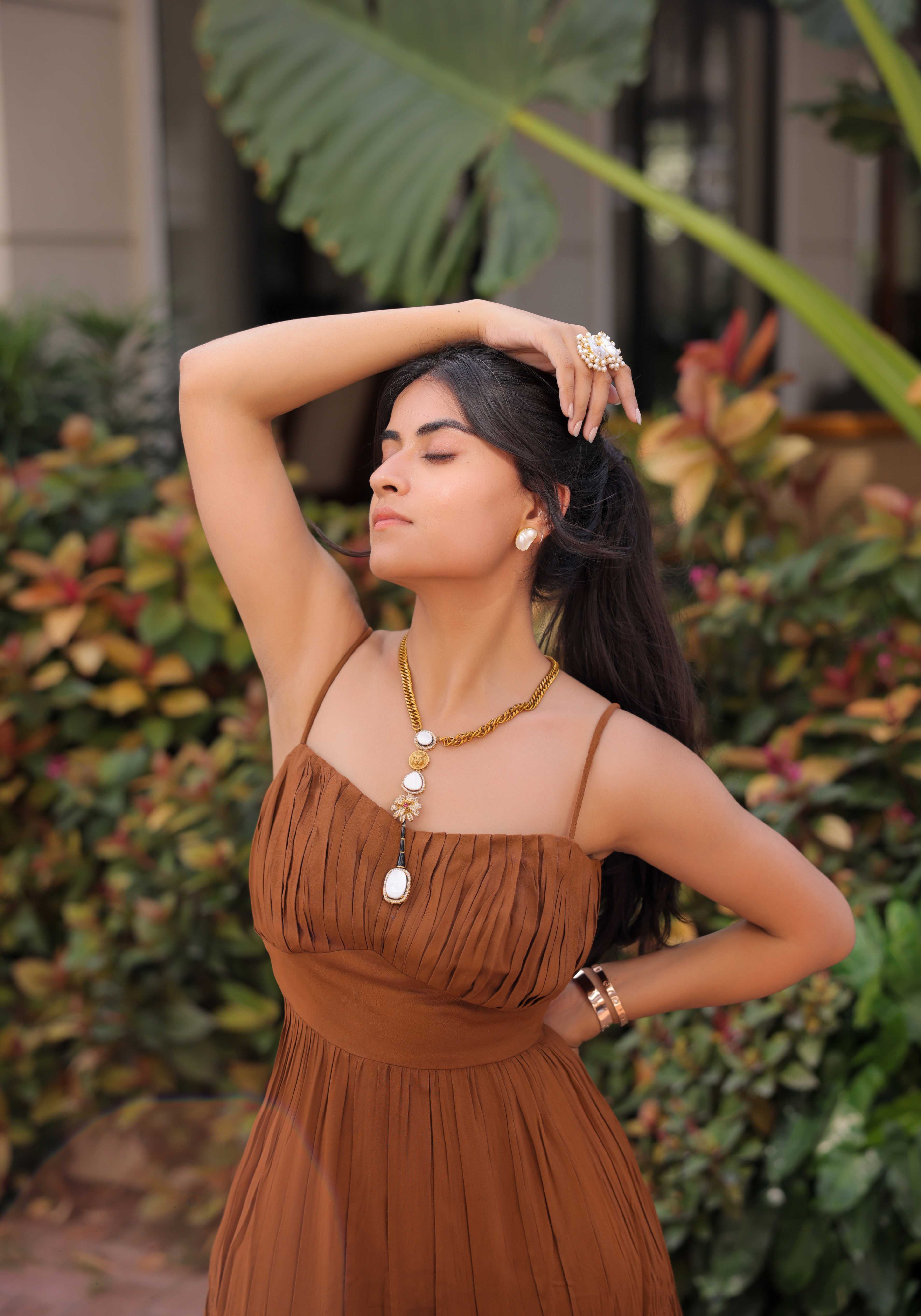 A model showcasing Brown Tiered Maxi Dress by Foram Patel from Foram Patel's collection