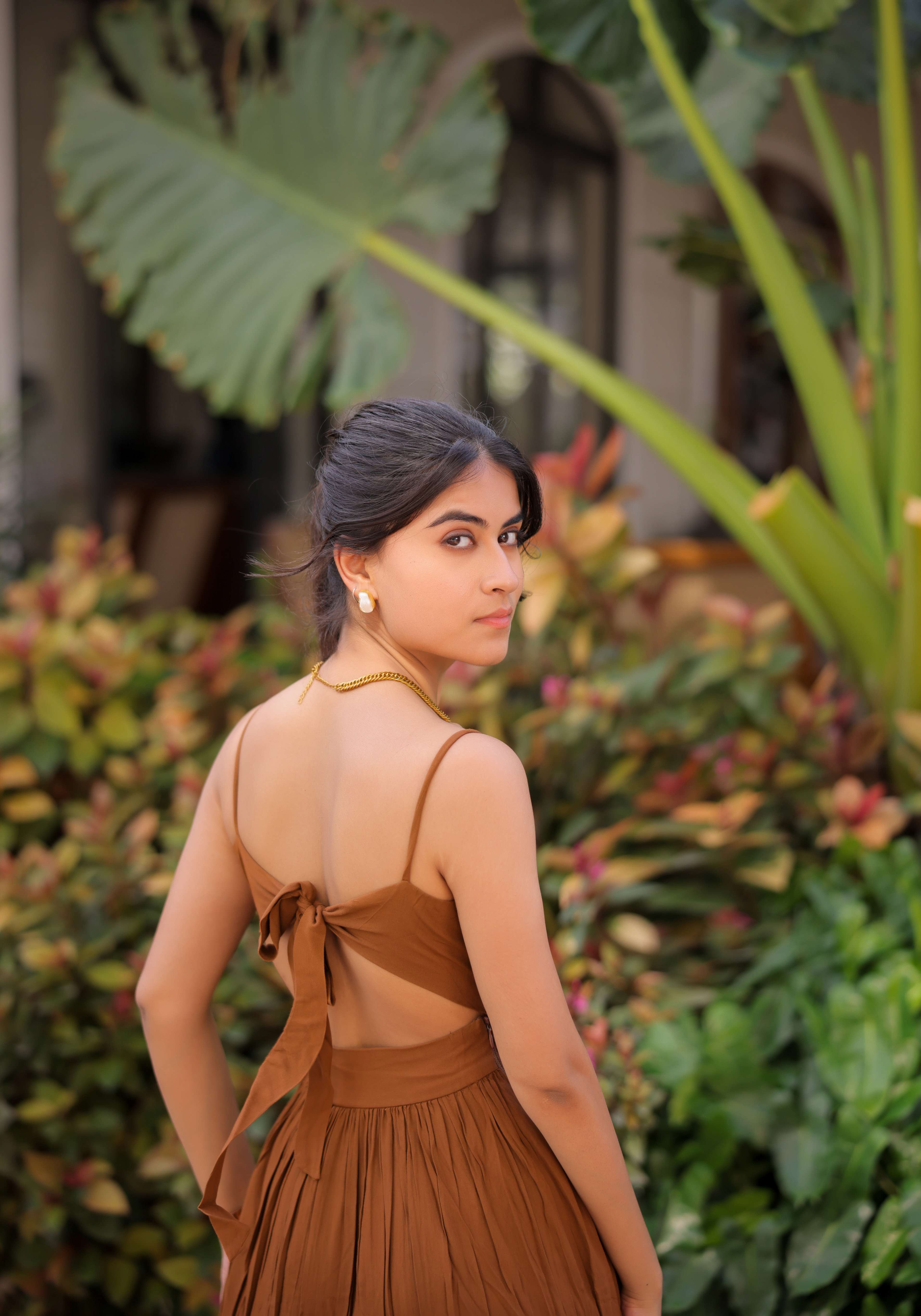 A model showcasing Brown Tiered Maxi Dress by Foram Patel from Foram Patel's collection