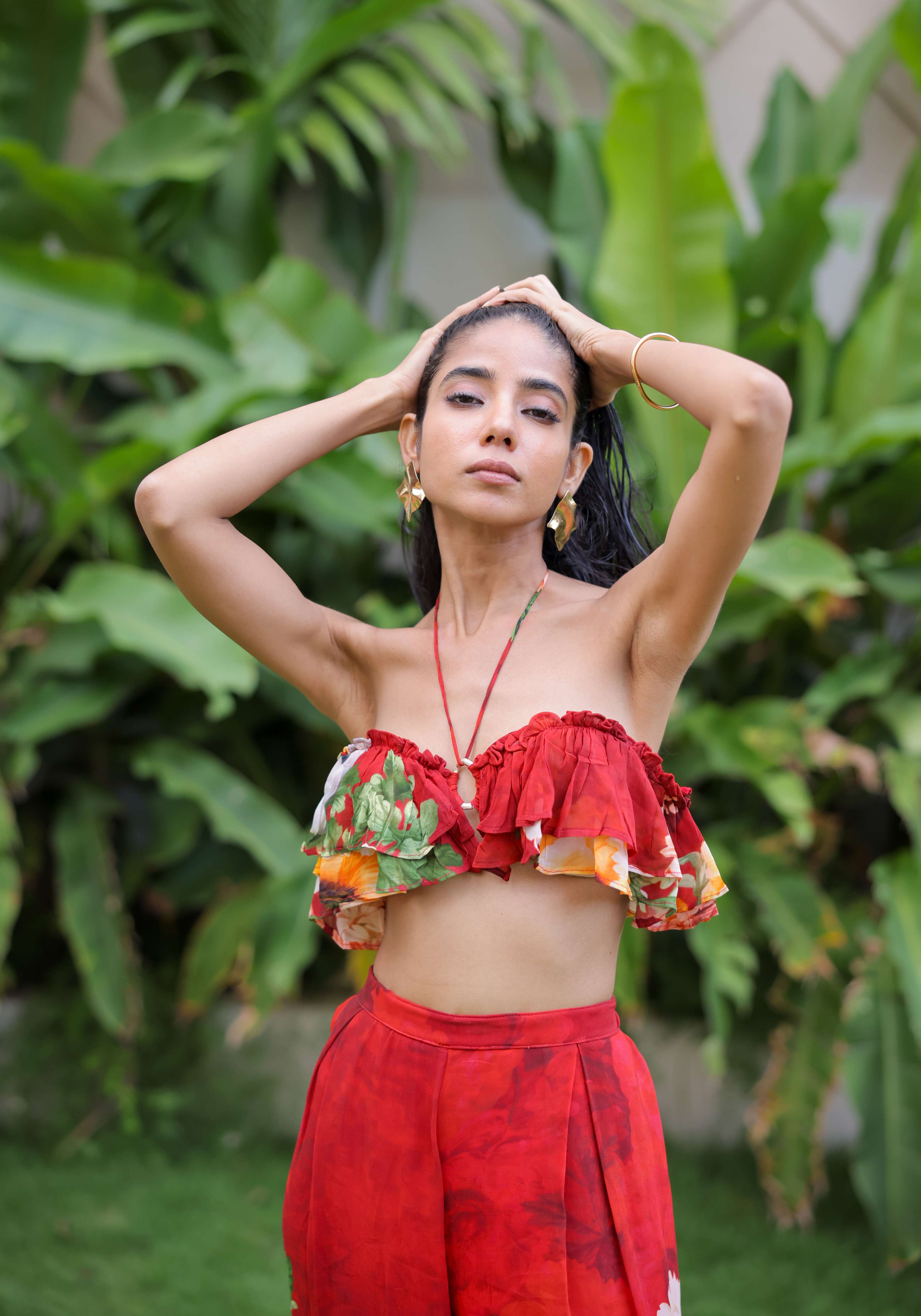 A model showcasing Red Floral Printed Ruffle Pant Set by Foram Patel from Foram Patel's collection