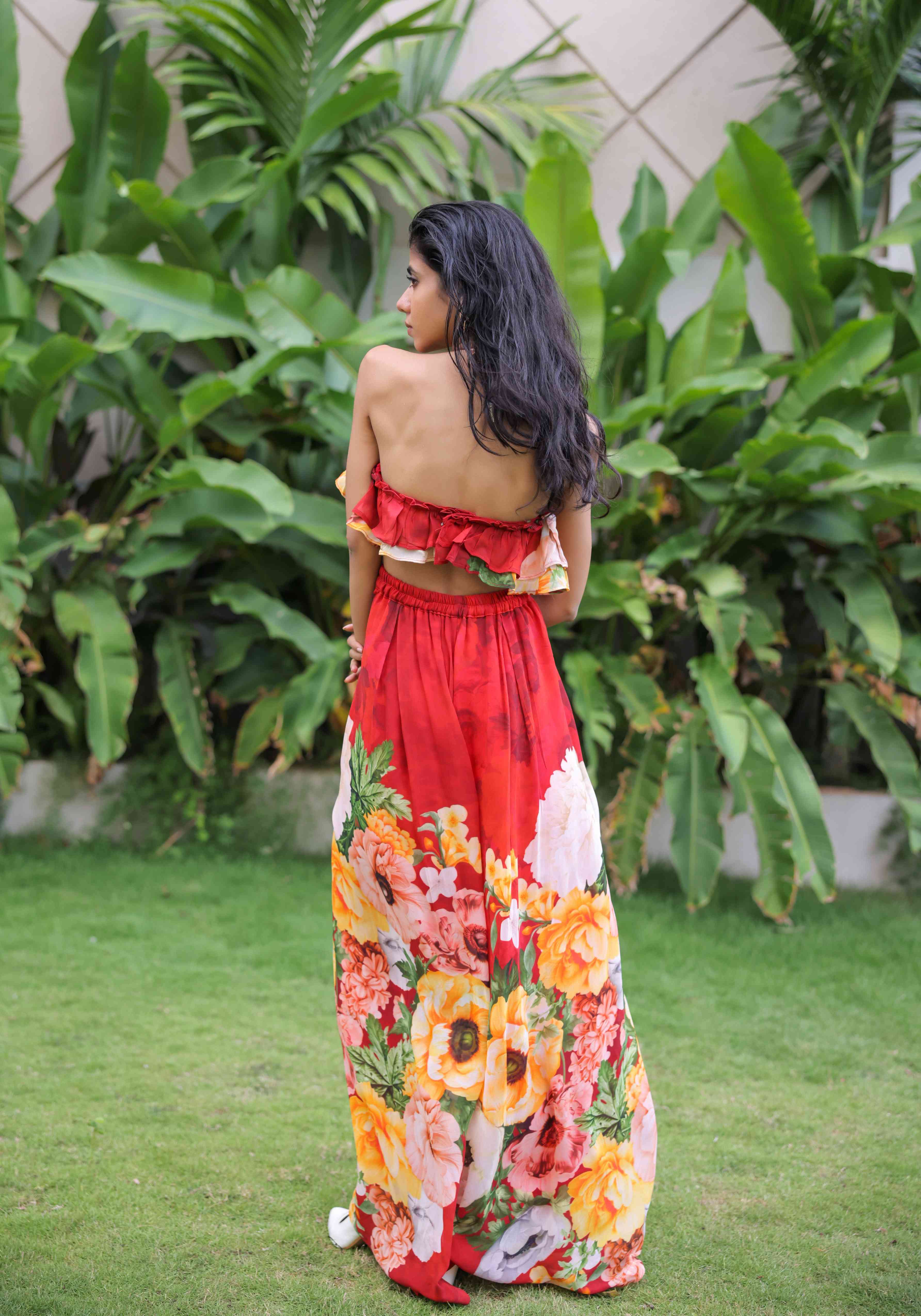 A model showcasing Red Floral Printed Ruffle Pant Set by Foram Patel from Foram Patel's collection