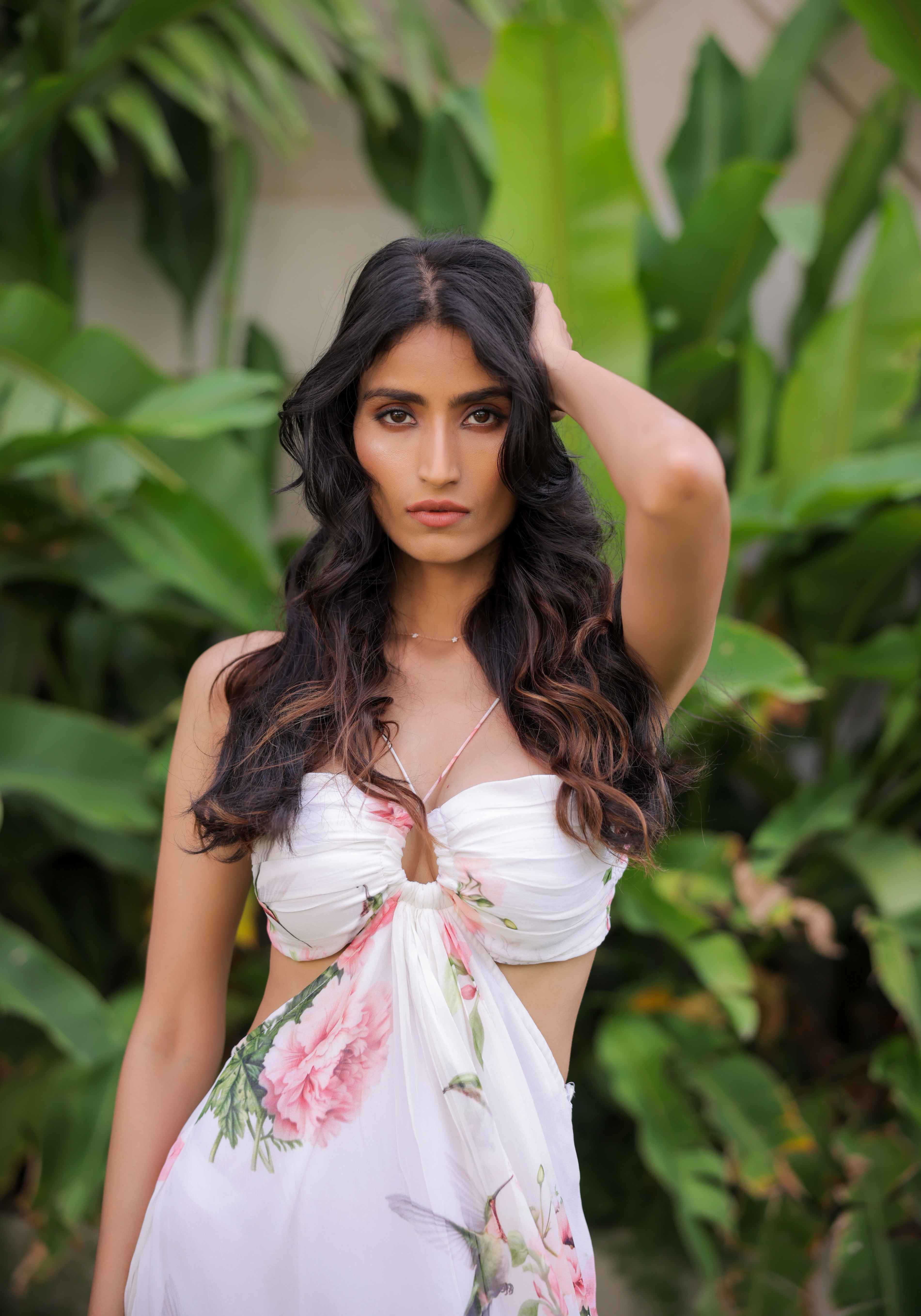A model showcasing White Floral Printed Maxi Dress by Foram Patel from Foram Patel's collection