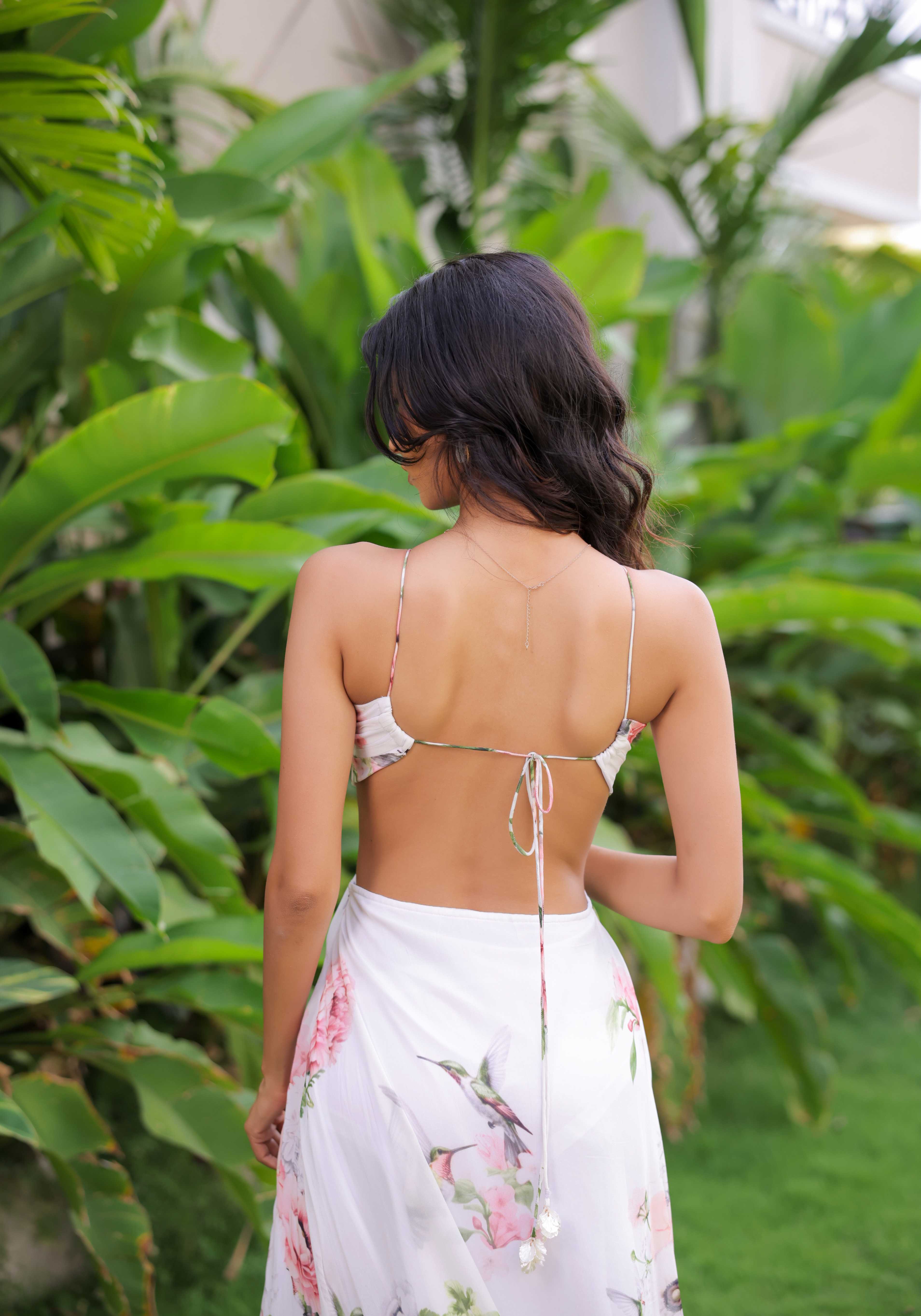 A model showcasing White Floral Printed Maxi Dress by Foram Patel from Foram Patel's collection