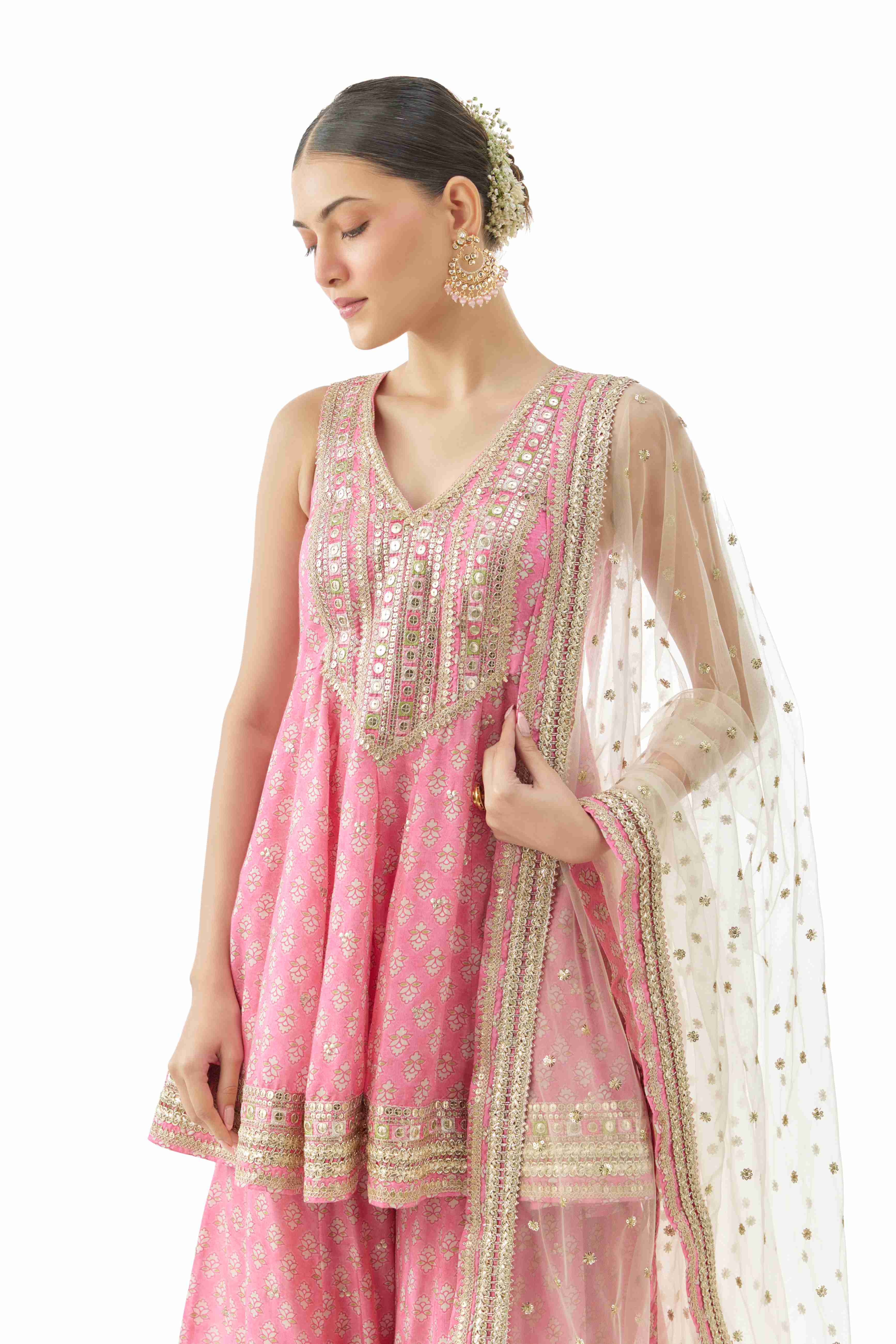 A model showcasing Simoni Pink Peplum Set by Gopi Vaid from Gopi Vaid's collection