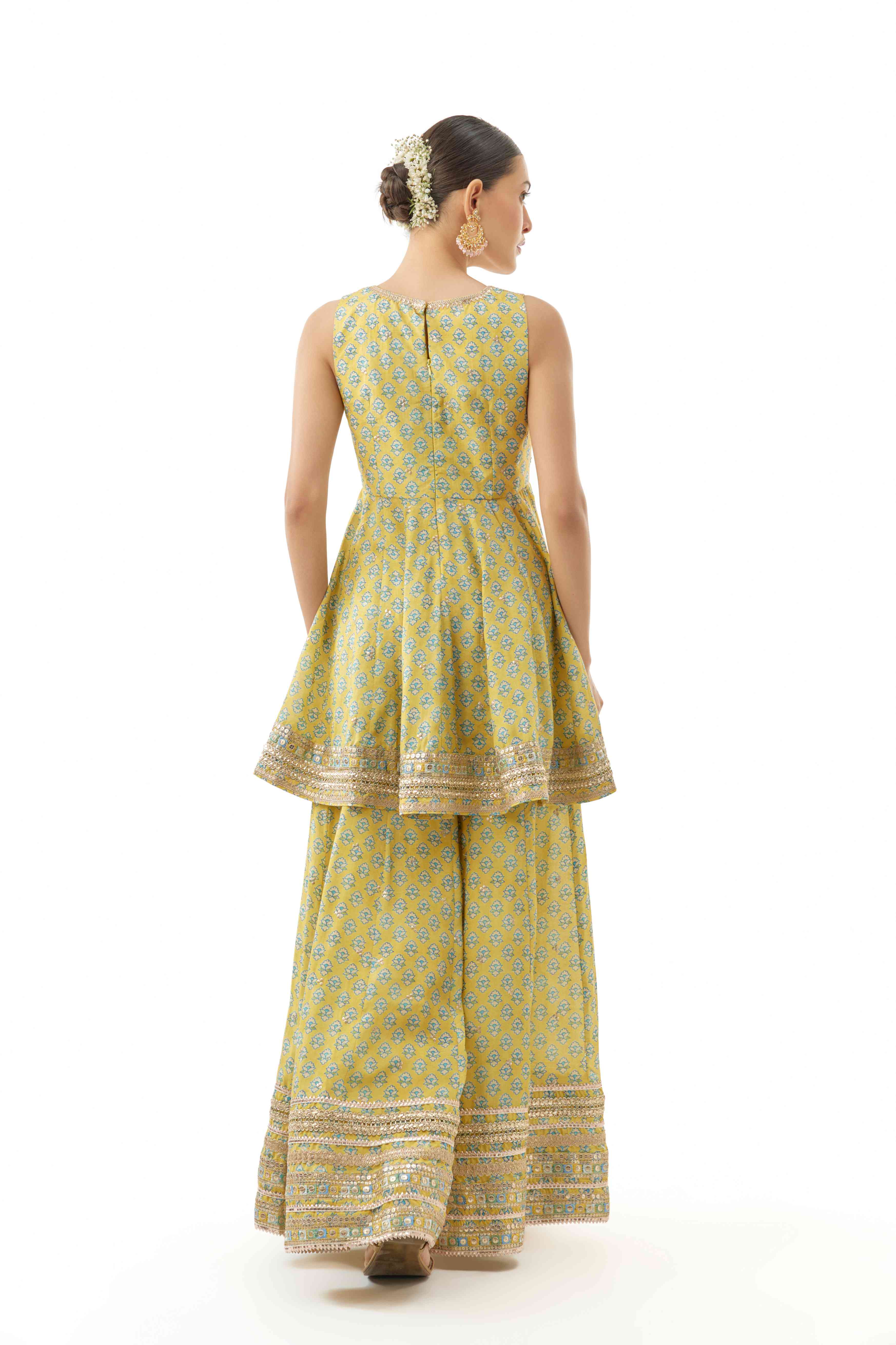 A model showcasing Simoni Cotton Silk Peplum Set by Gopi Vaid from Gopi Vaid's collection