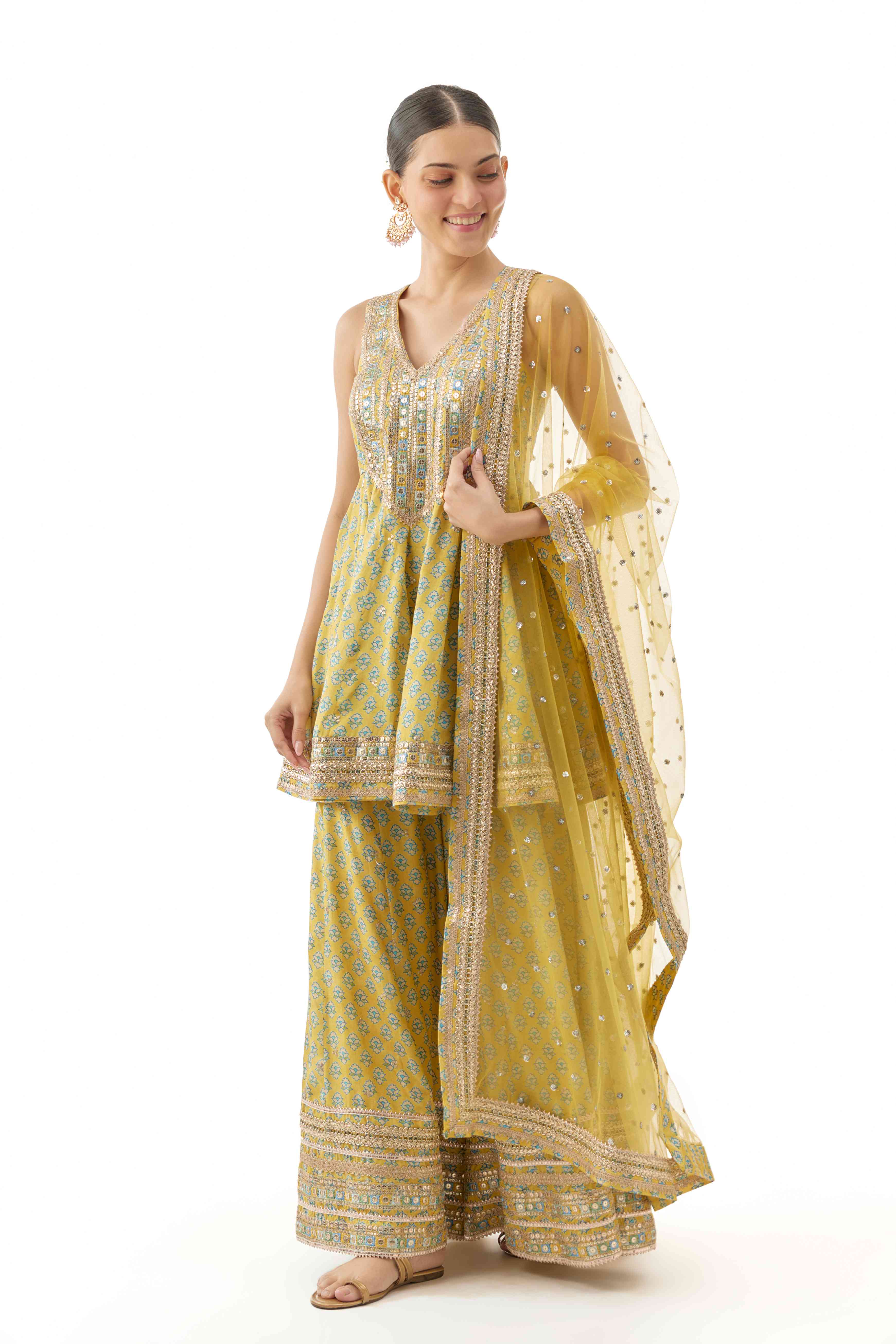 A model showcasing Simoni Cotton Silk Peplum Set by Gopi Vaid from Gopi Vaid's collection