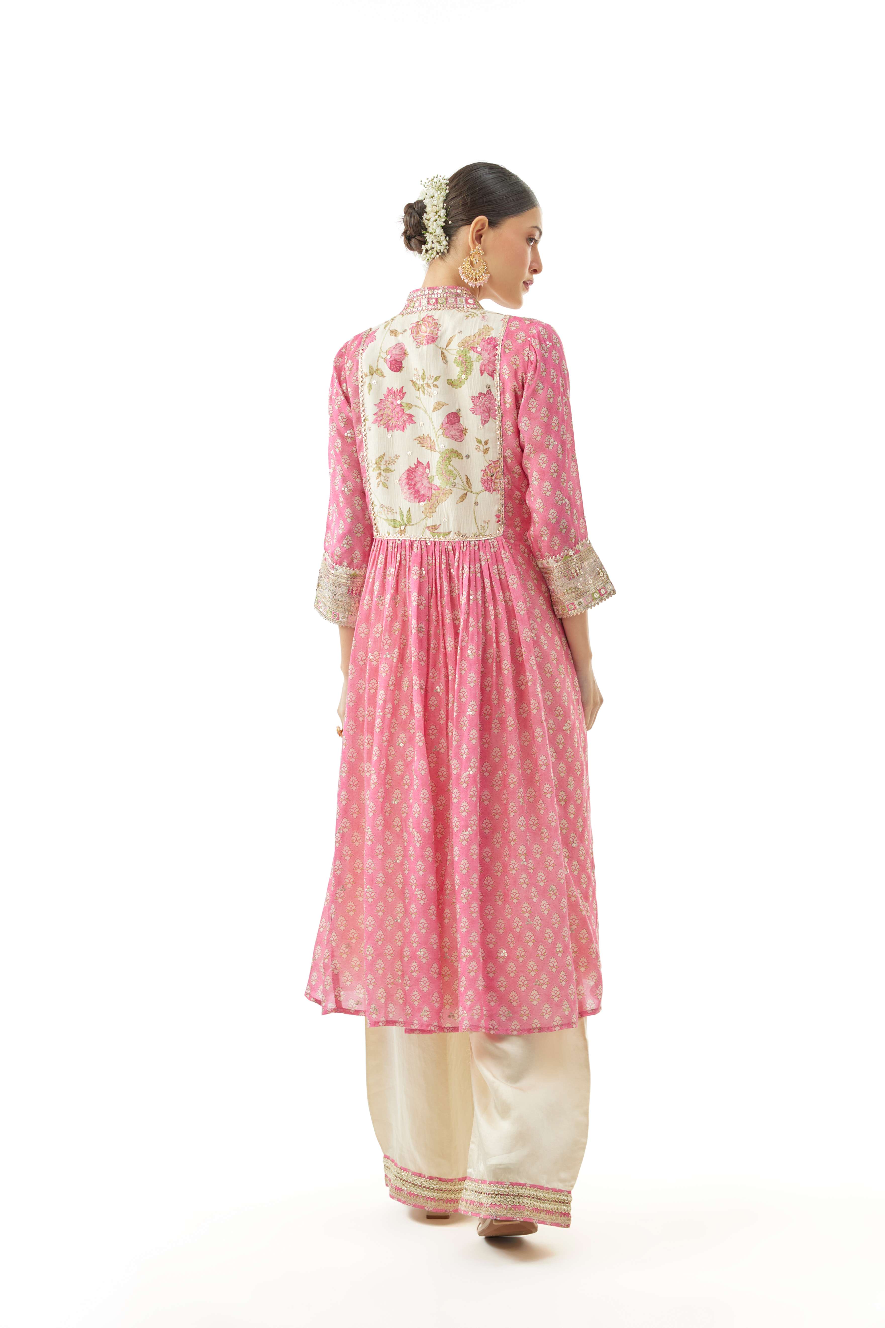 A model showcasing Riya Pink Cotton Silktunic by Gopi Vaid from Gopi Vaid's collection A model showcasing Riya Pink Cotton Silktunic by Gopi Vaid from Gopi Vaid's collection