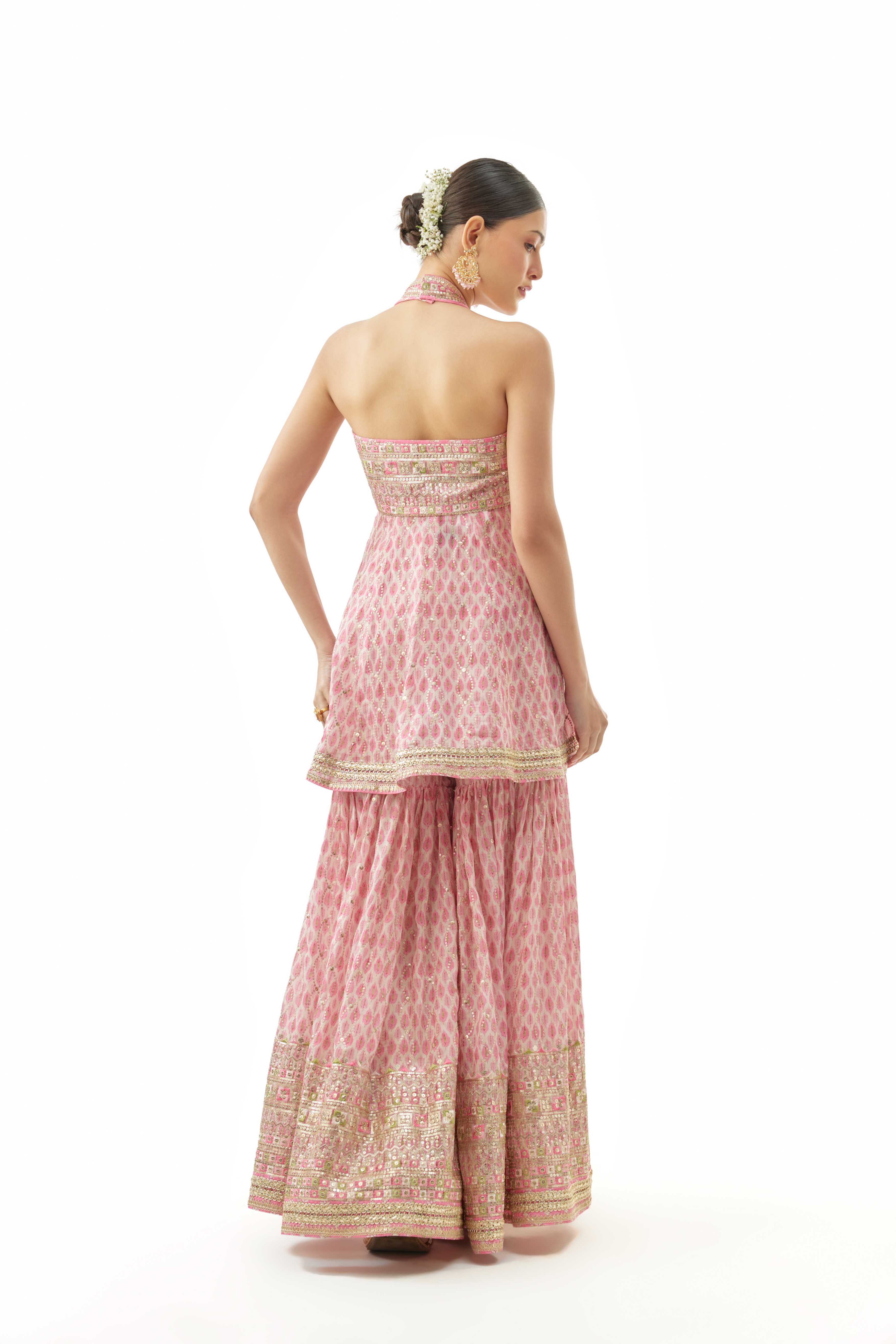A model showcasing Janhavi Peplum Set by Gopi Vaid from Gopi Vaid's collection