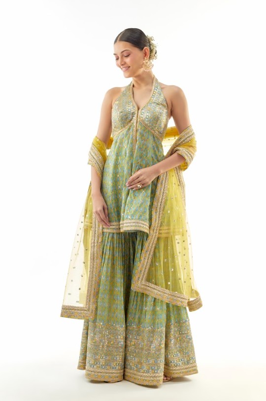 A model showcasing Janhavi Cotton Silk Peplum Set by Gopi Vaid from Gopi Vaid's collection