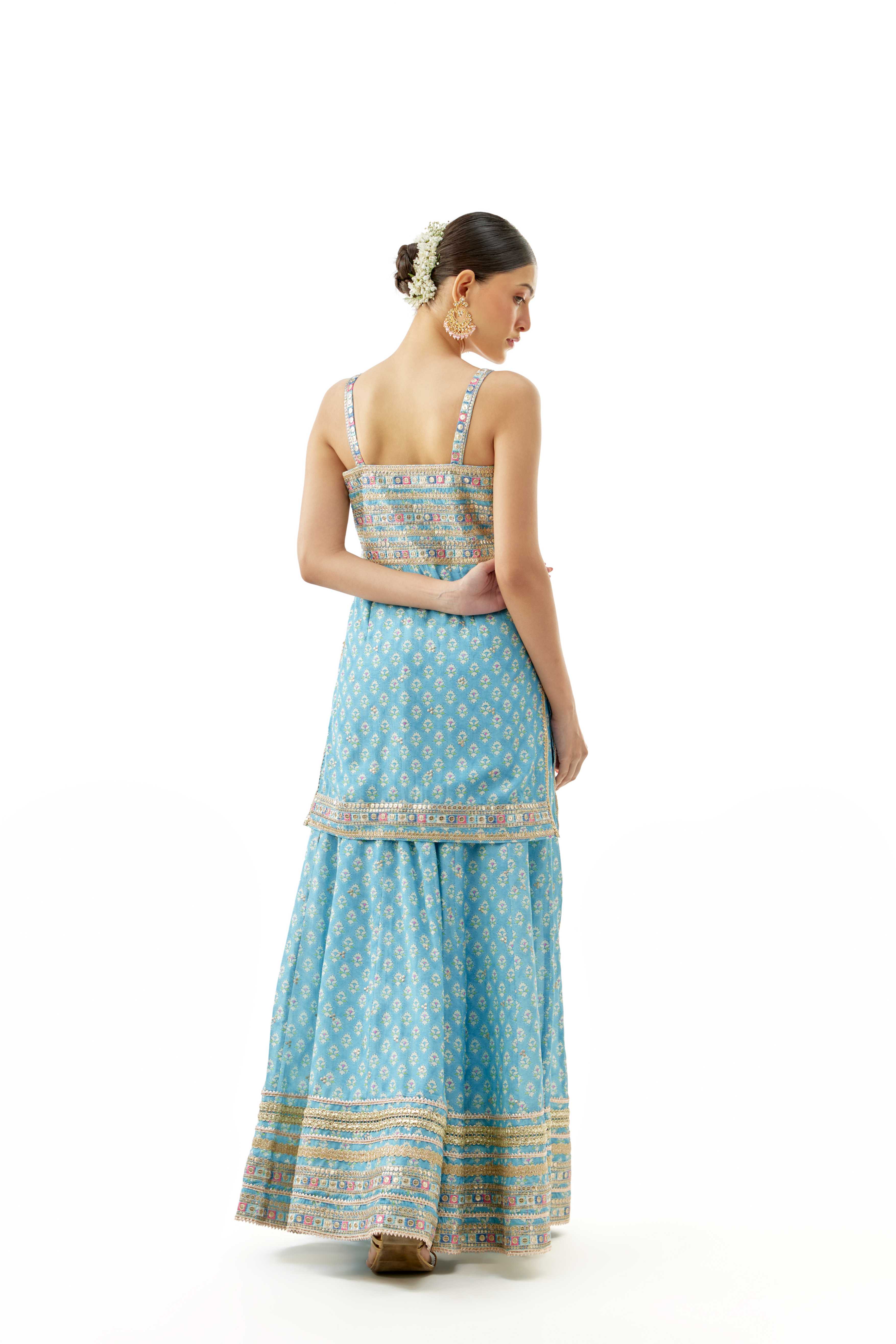 A model showcasing Nitya Blue Strappy Set by Gopi Vaid from Gopi Vaid's collection