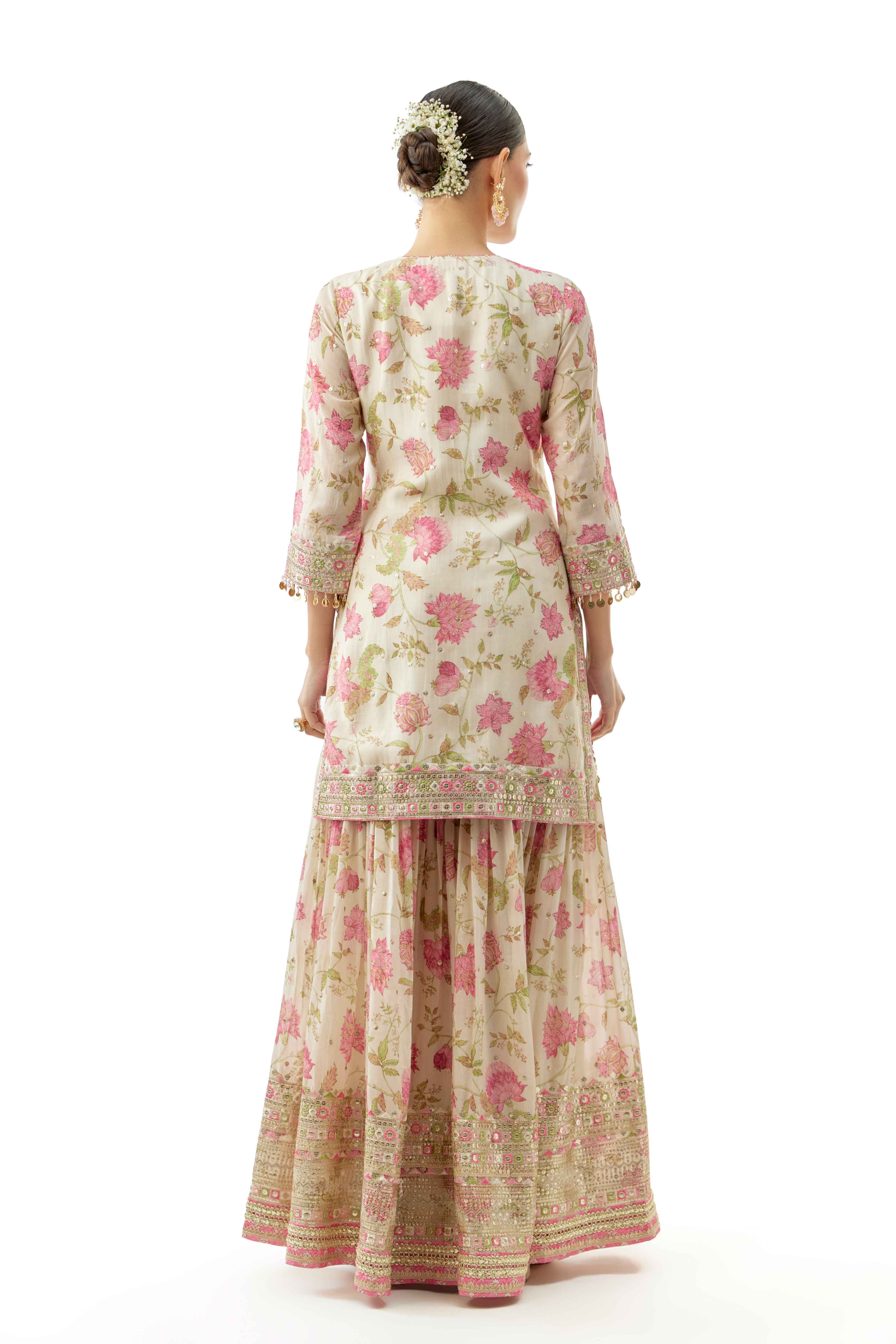 A model showcasing Niyati Ivory Sharara Set by Gopi Vaid from Gopi Vaid's collection