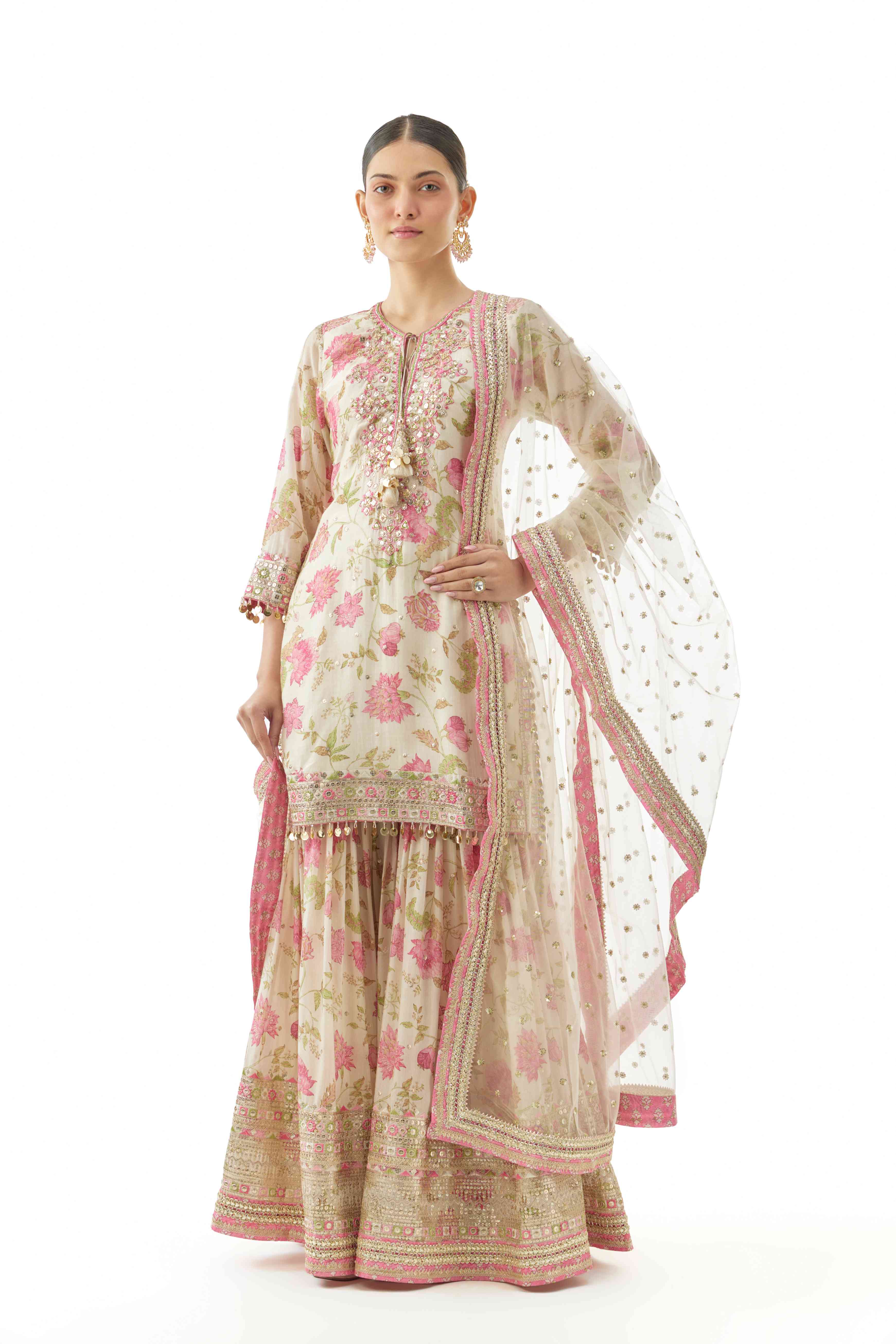 A model showcasing Niyati Ivory Sharara Set by Gopi Vaid from Gopi Vaid's collection
