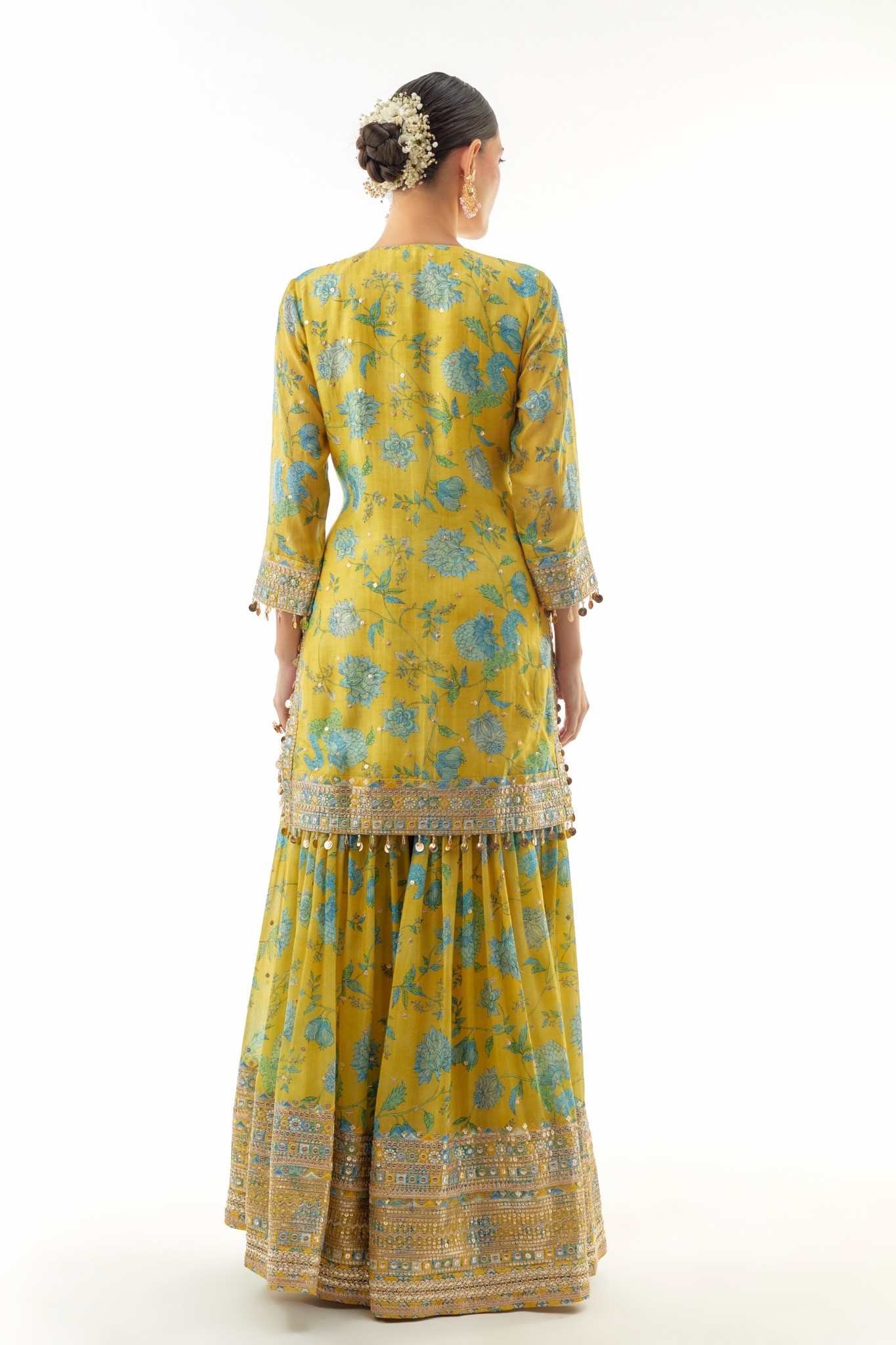 A model showcasing Niyati Yellow Sharara Set by Gopi Vaid from Gopi Vaid's collection