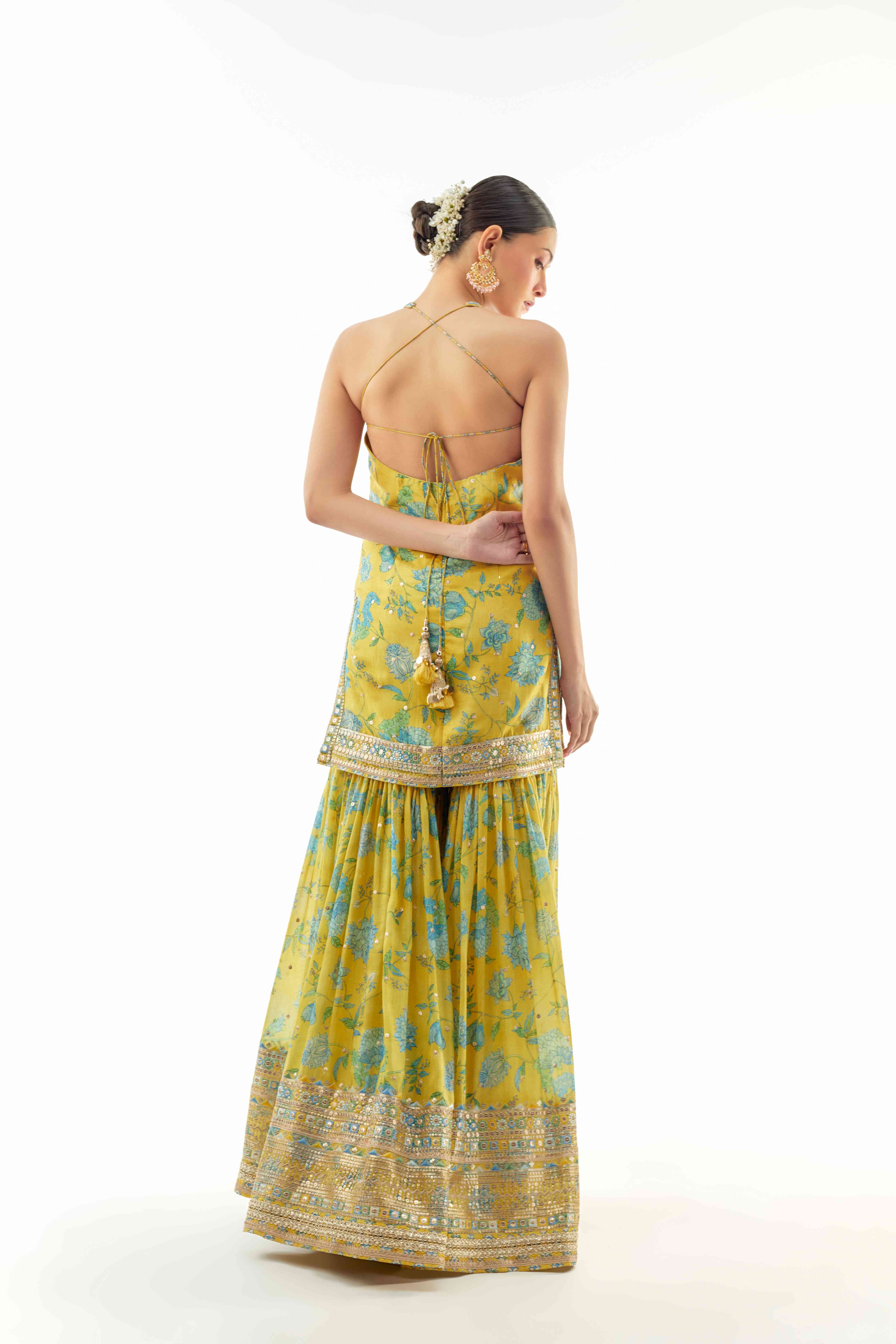 A model showcasing Dhvanika Halter Set by Gopi Vaid from Gopi Vaid's collection